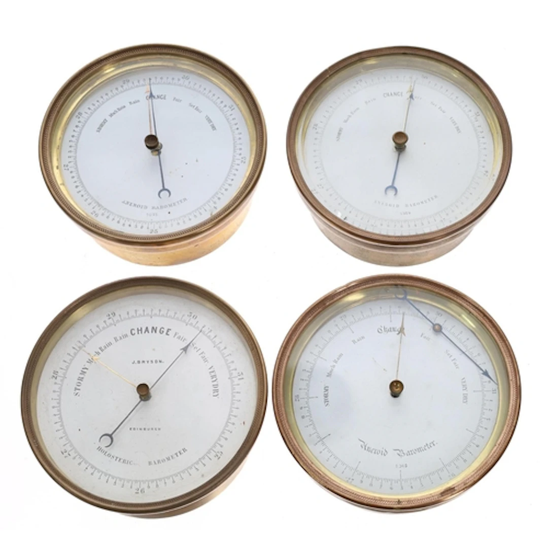 Four similar brass drum cased aneroid barometers, one signed...
