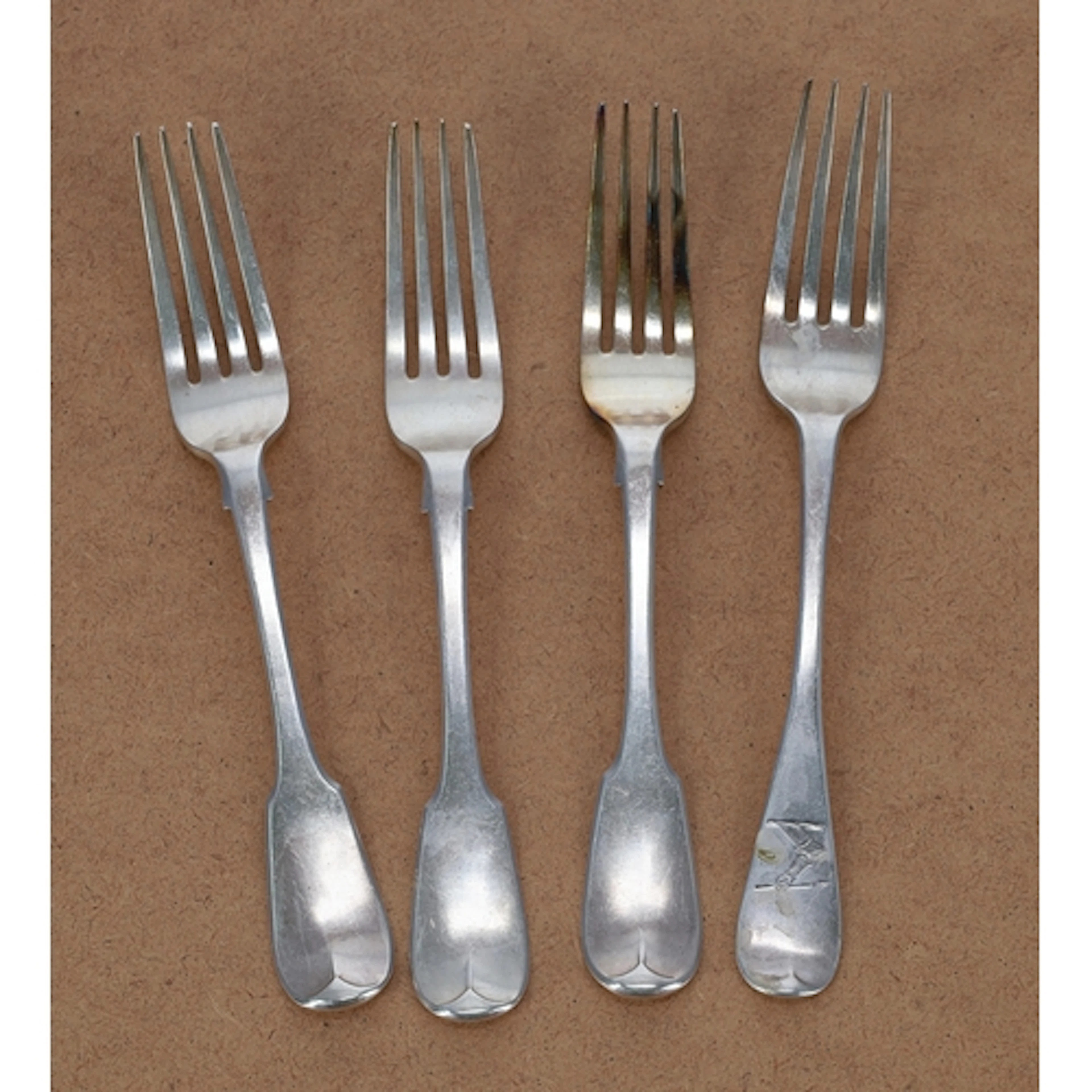 Set of three William IV silver fiddle pattern table forks, e...
