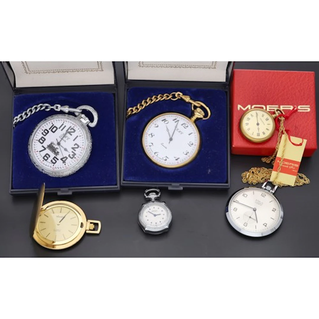 Two KMC Quartz pocket watches, with curb chains; each with K...