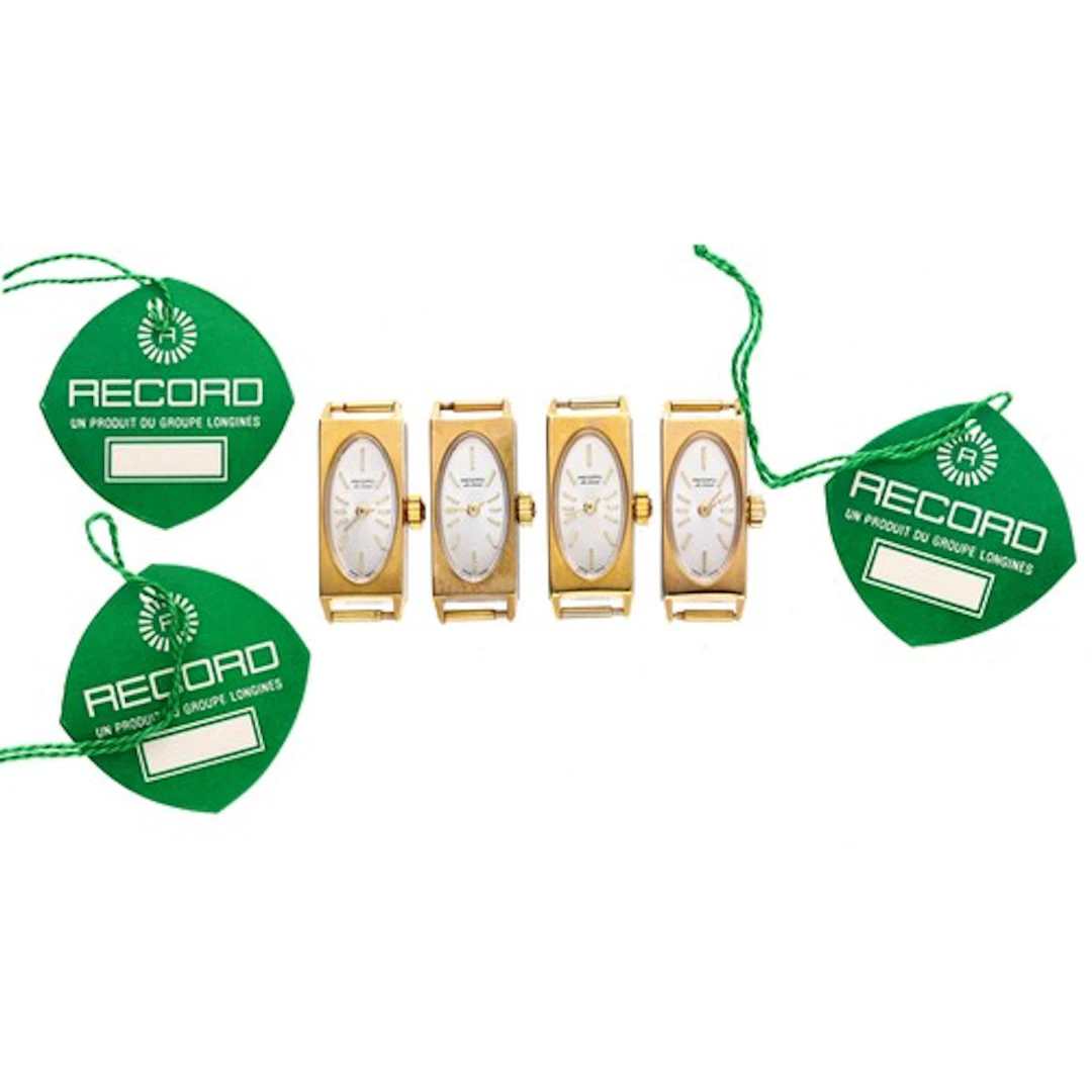 Four Record De Luxe rectangular gold plated and stainless st...
