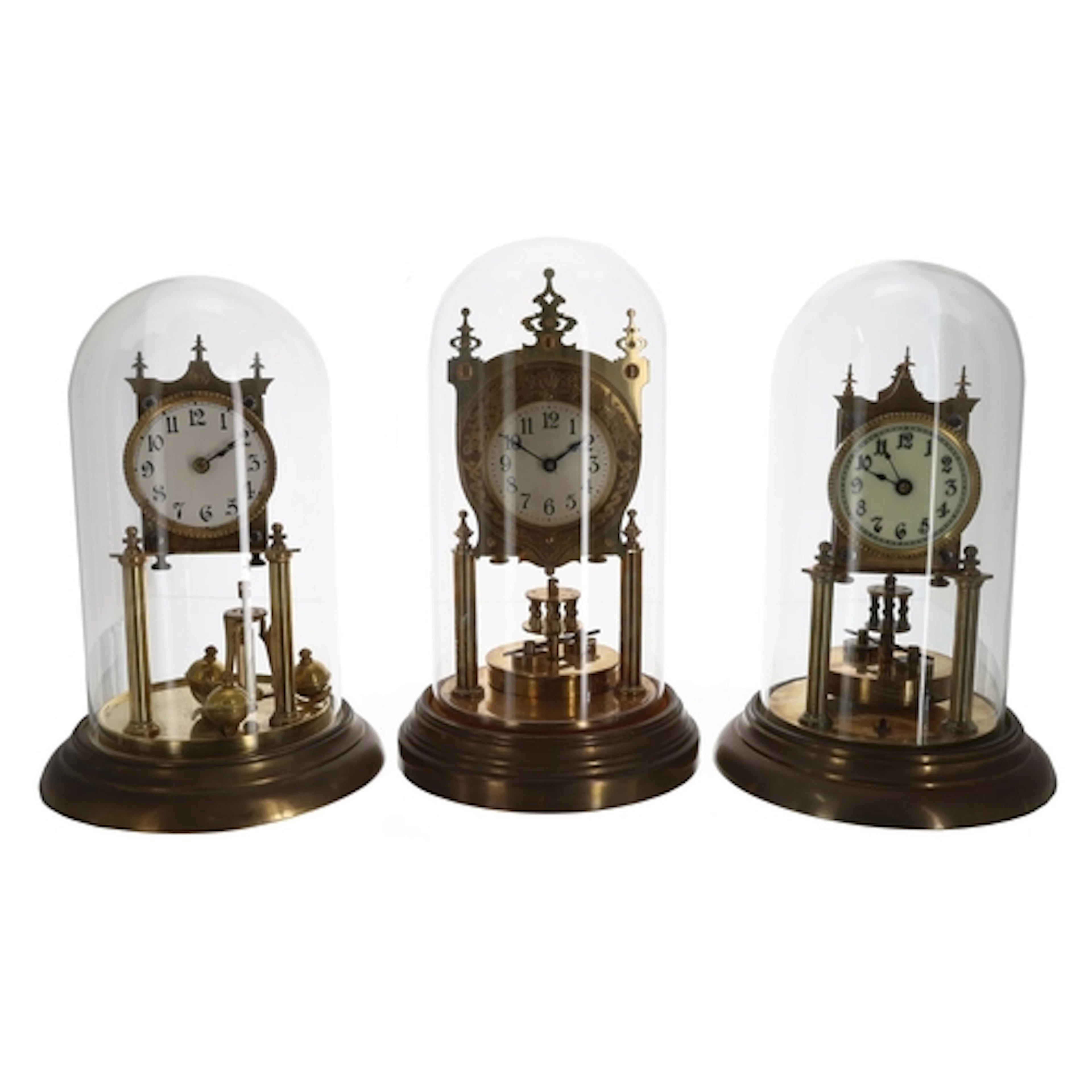 Group of three German brass torsion clocks, two with disc pe...
