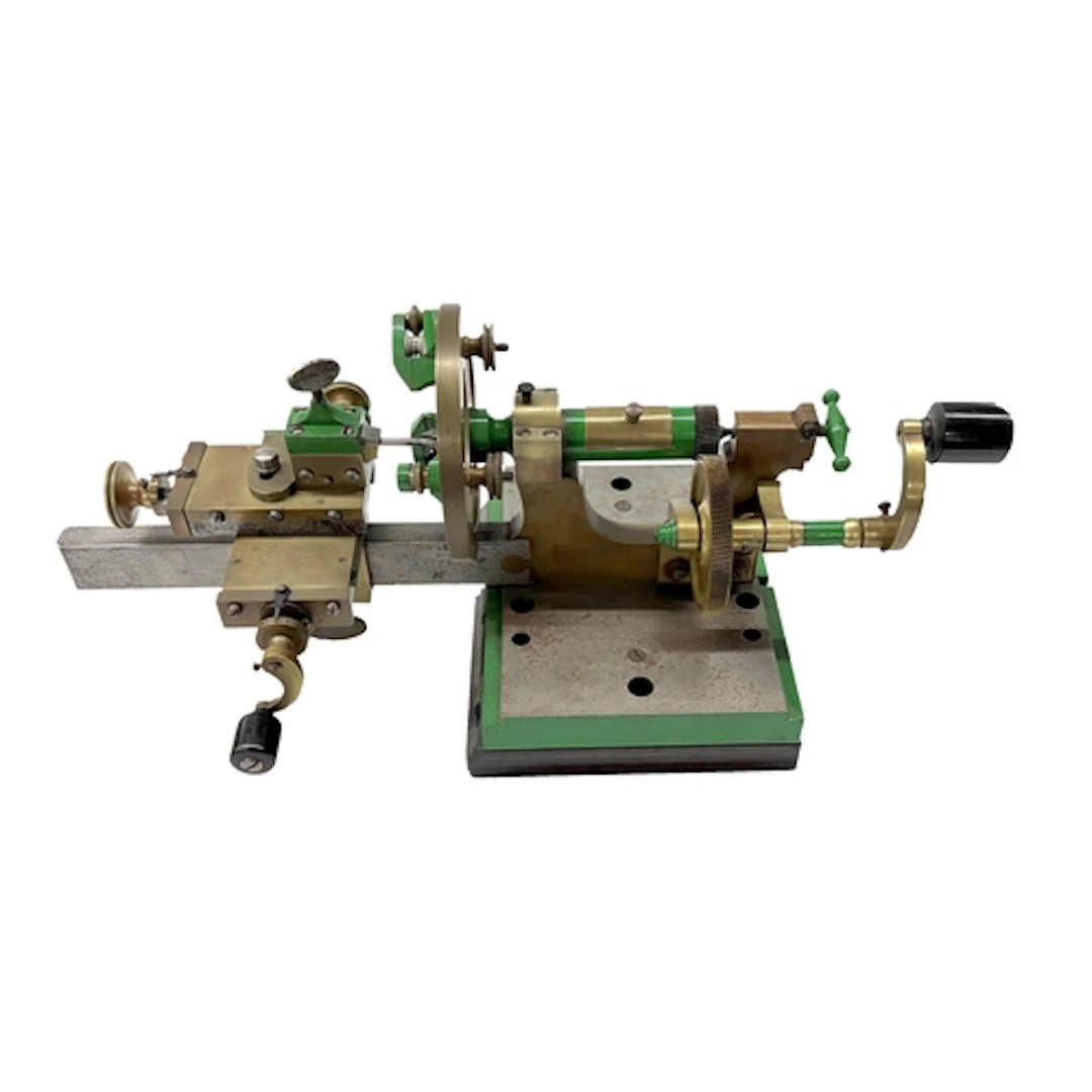 Watchmakers mandrel lathe mounted on a metal with compound s...