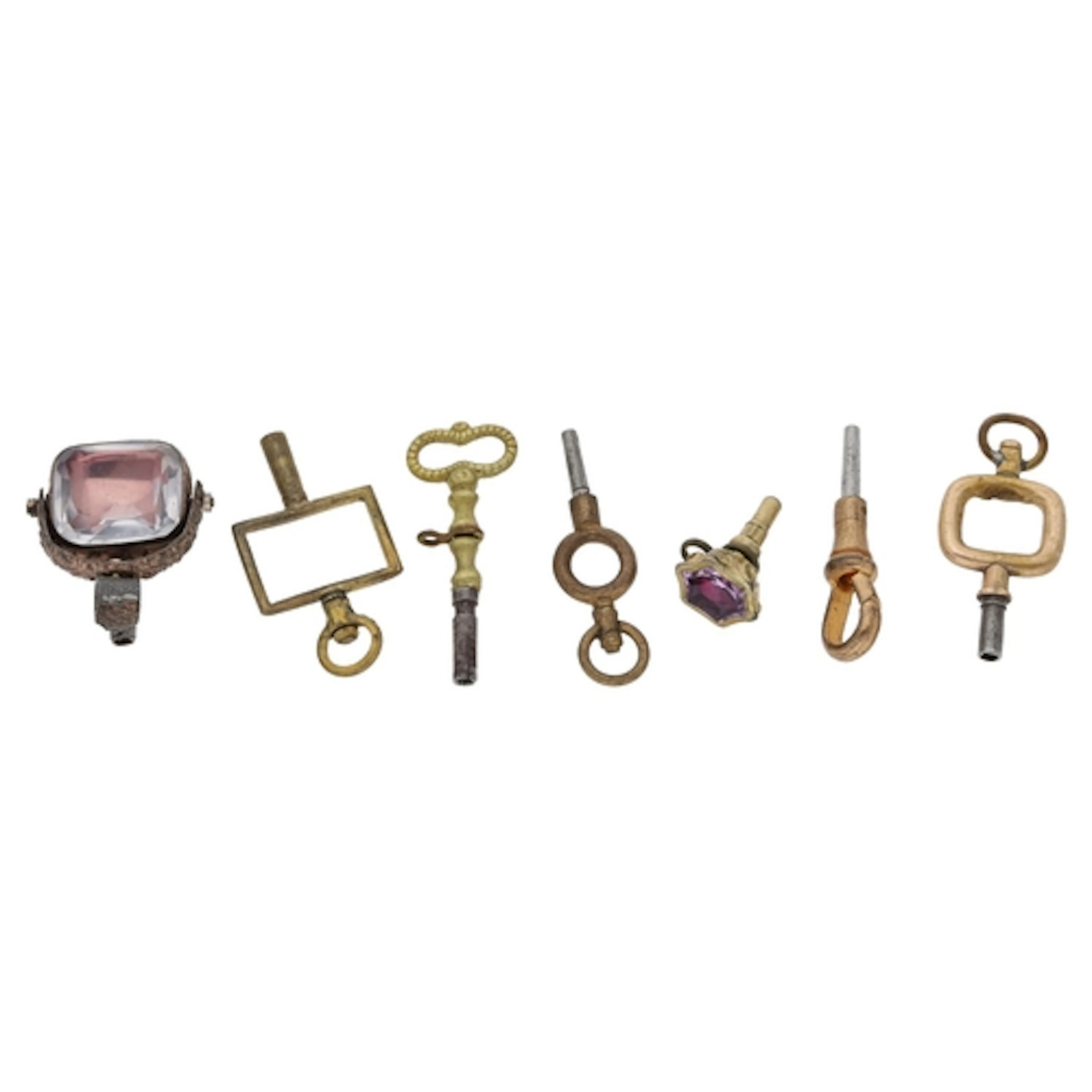 Seven assorted pocket watch keys to include two stone set ke...