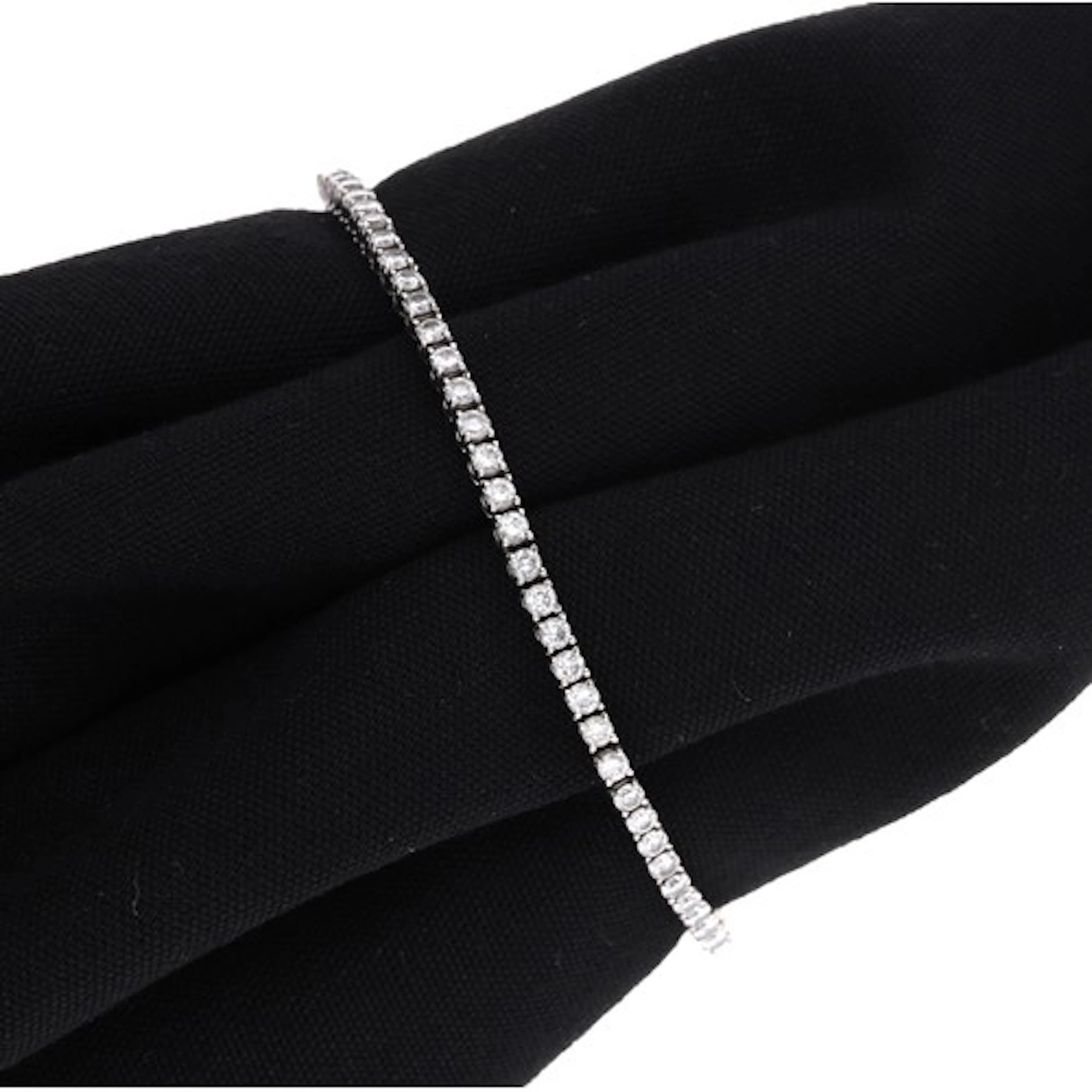Modern 18ct white gold diamond line bracelet, stamped 750, w...