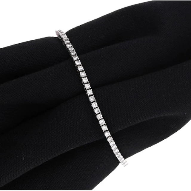 Modern 18ct white gold diamond line bracelet, stamped 750, w...