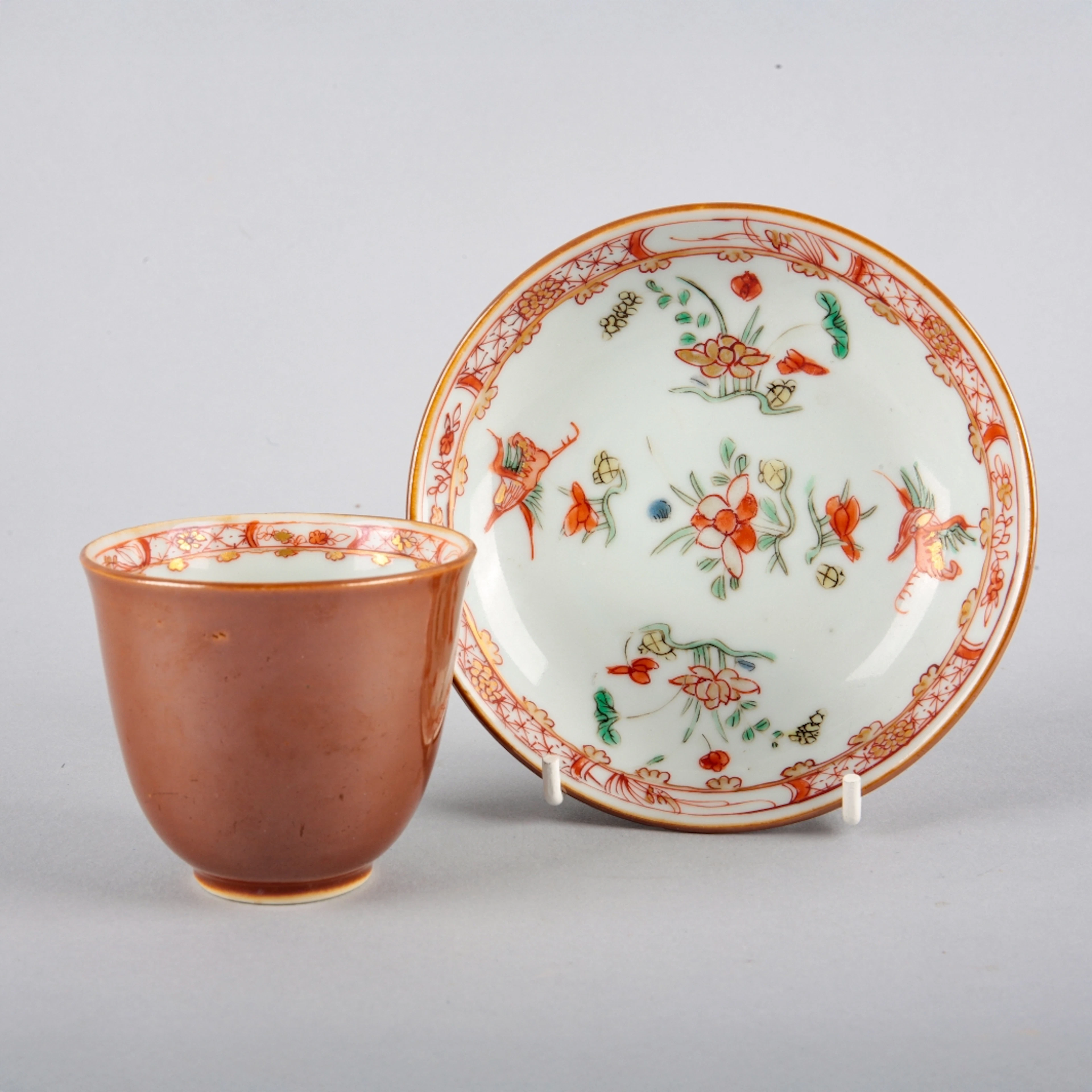 A CHINESE EXPORT PORCELAIN FAMILLE VERTE CUP AND SAUCER