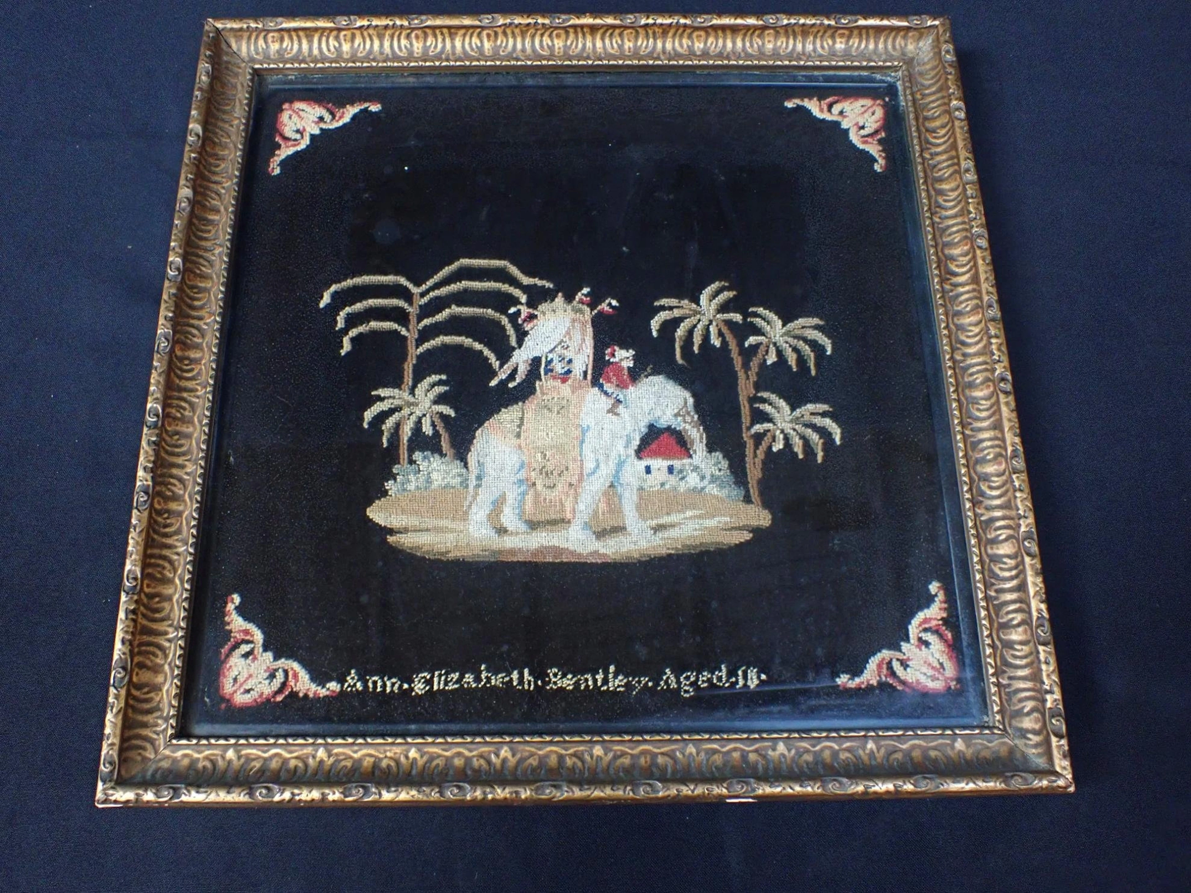 A VICTORIAN WOOL WORK PICTURE OF AN ELEPHANT