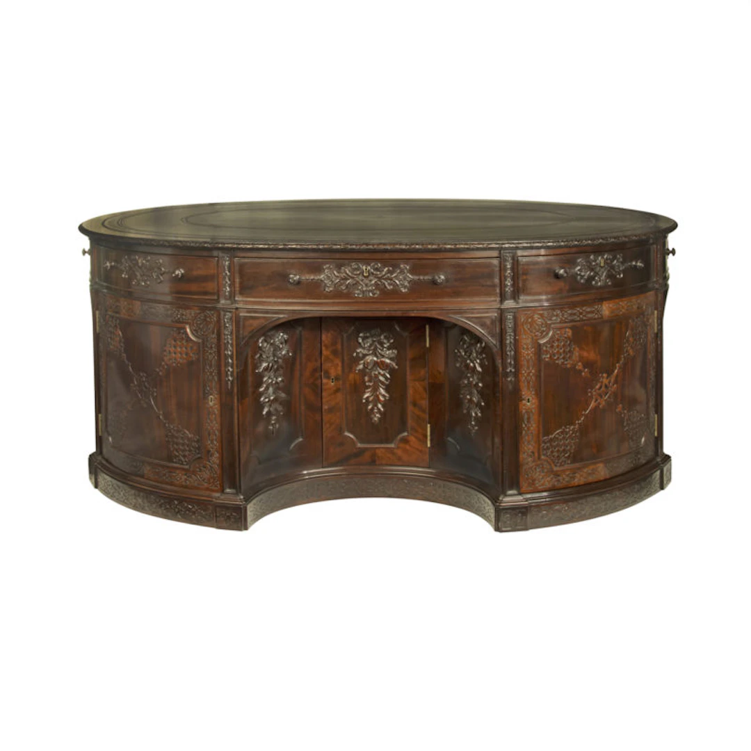A very large mahogany centrepiece partners’ desk in the Chippendale