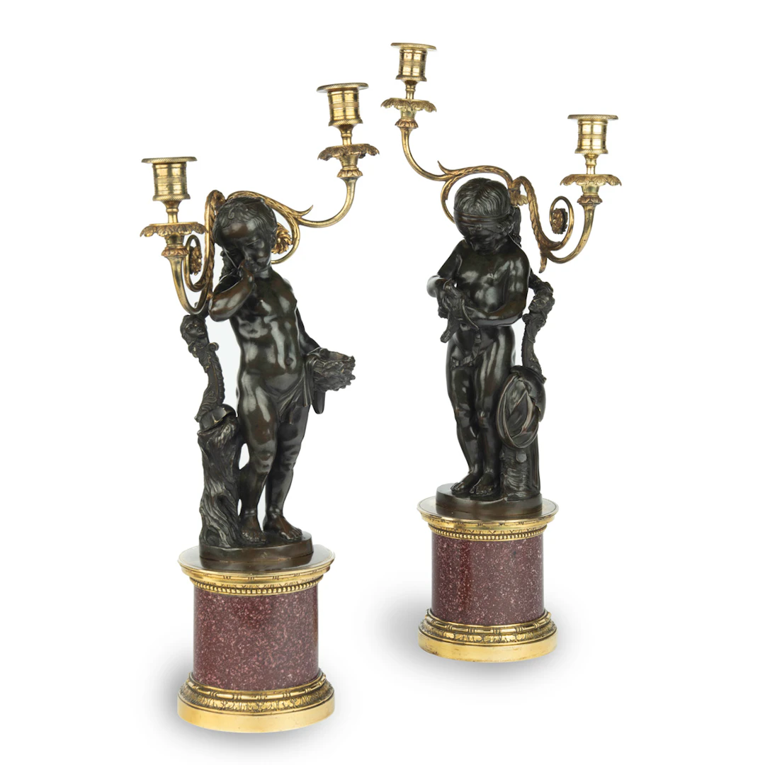 A pair of Egyptian porphyry and bronze candelabra after Charles-Antoine Bridan