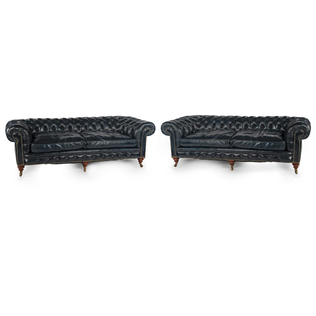 An unusual pair of Victorian walnut deep buttoned chesterfields