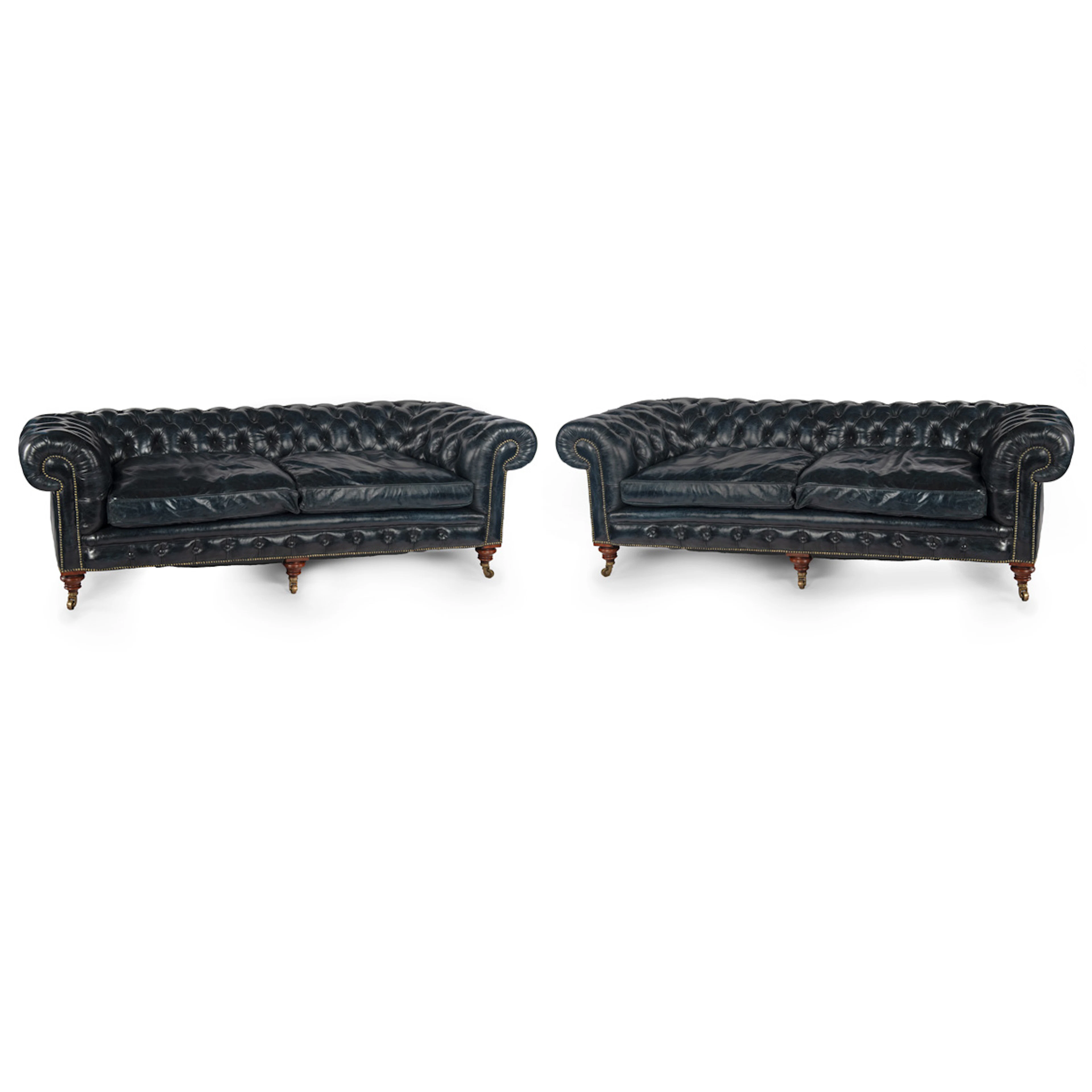 An unusual pair of Victorian walnut deep buttoned chesterfields