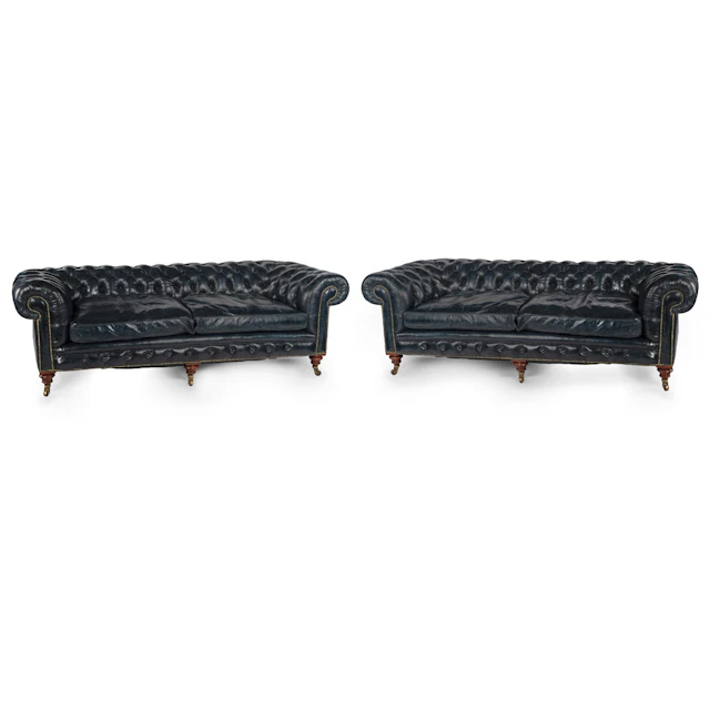 An unusual pair of Victorian walnut deep buttoned chesterfields