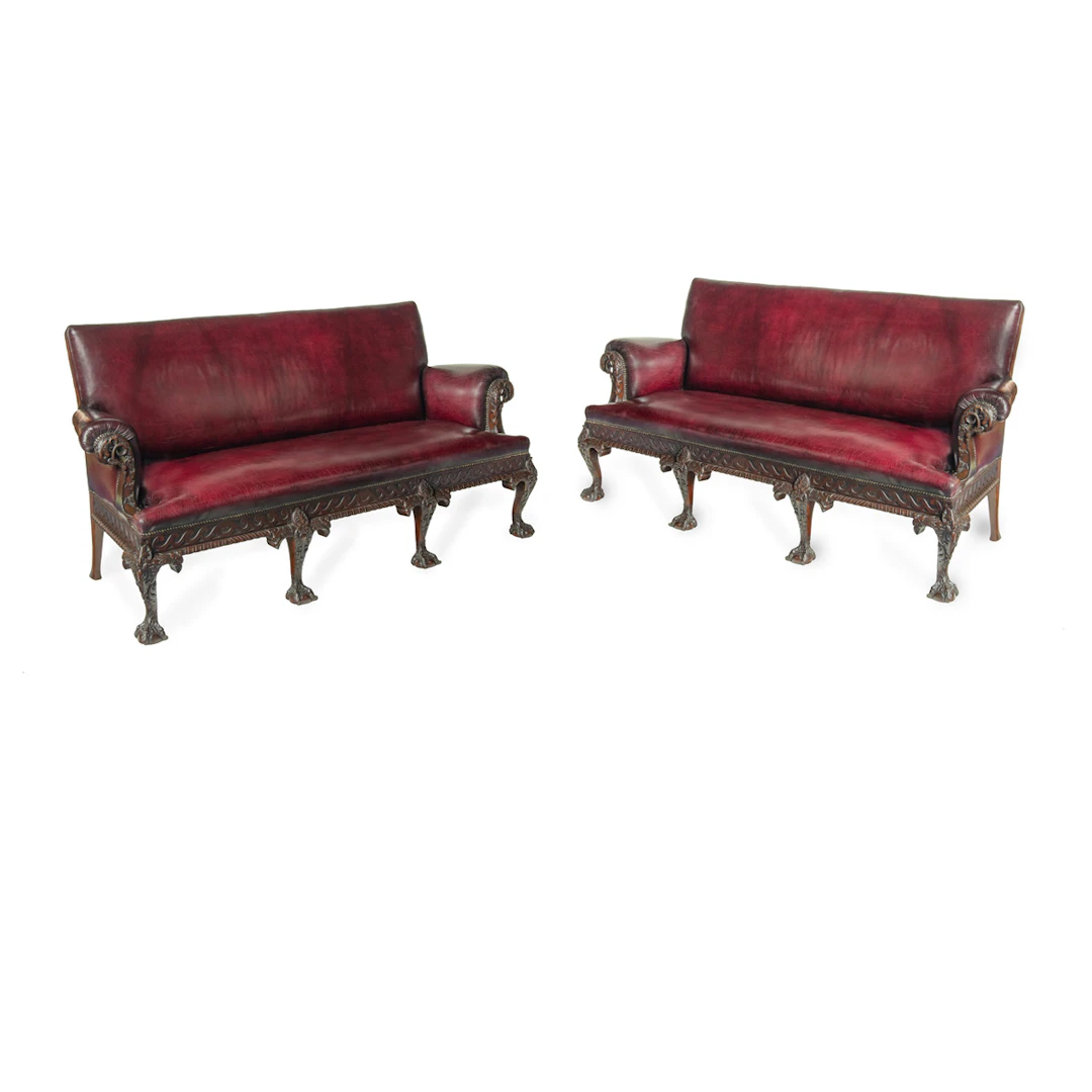 A fine pair of large late Victorian mahogany eagle sofas
