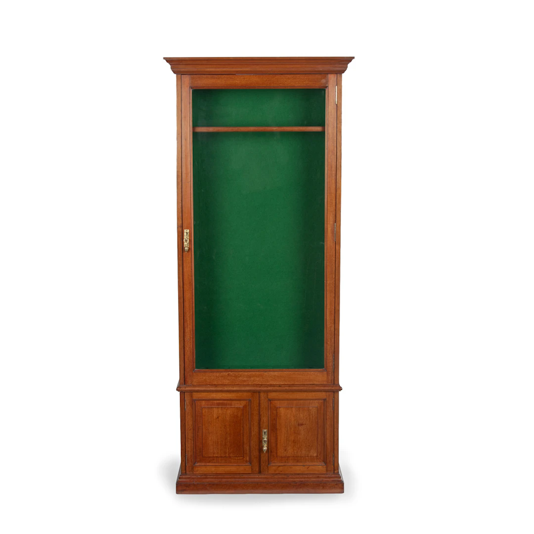 A late Victorian faded mahogany gun cabinet