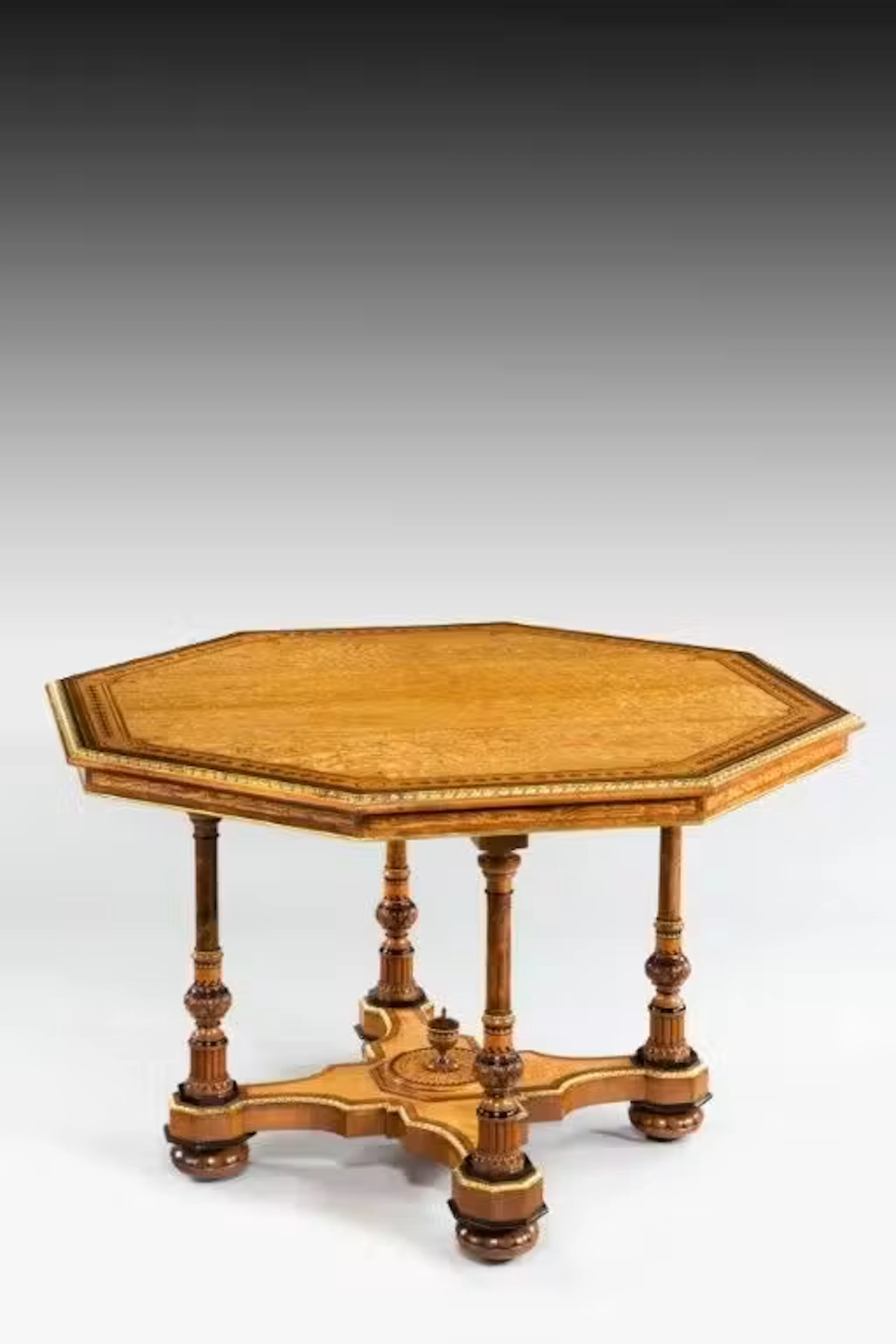 A Hungarian-ash centre table attributed to Holland and Sons