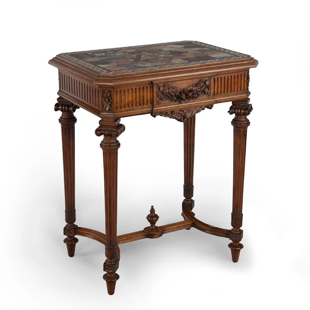 An unusual early 20th century walnut Lyon-Made table supporting an