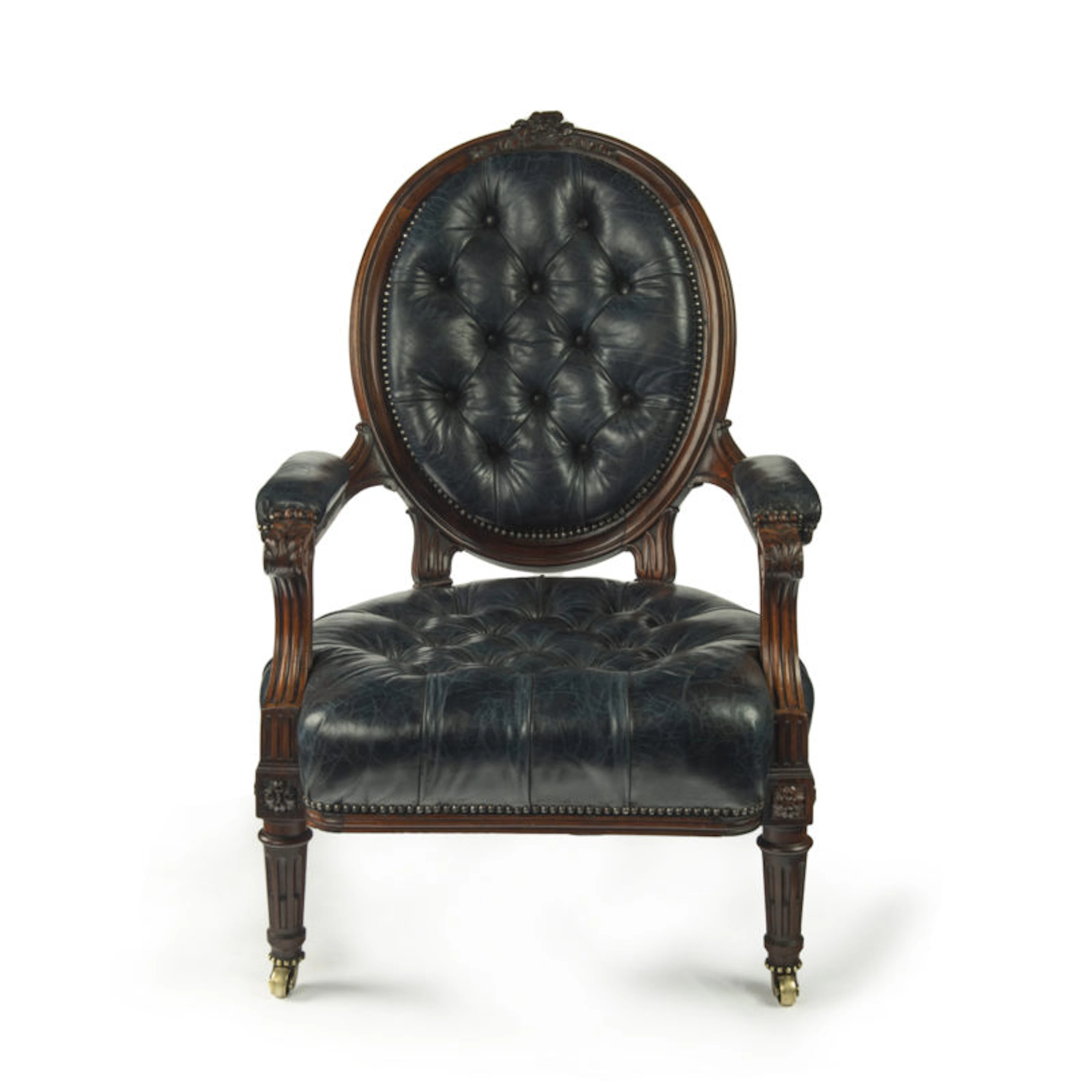 A Victorian rosewood medallion backed open arm chair by Holland & Sons