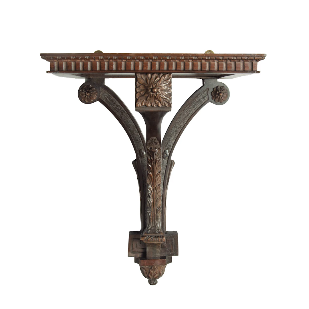 A late Victorian mahogany wall bracket for a clock, by Edwards and Roberts