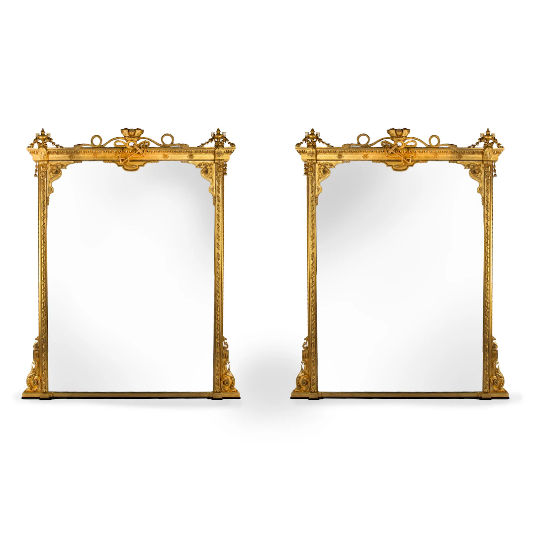 A Fine Pair of Giltwood Overmantel Mirrors with the Emblems of the