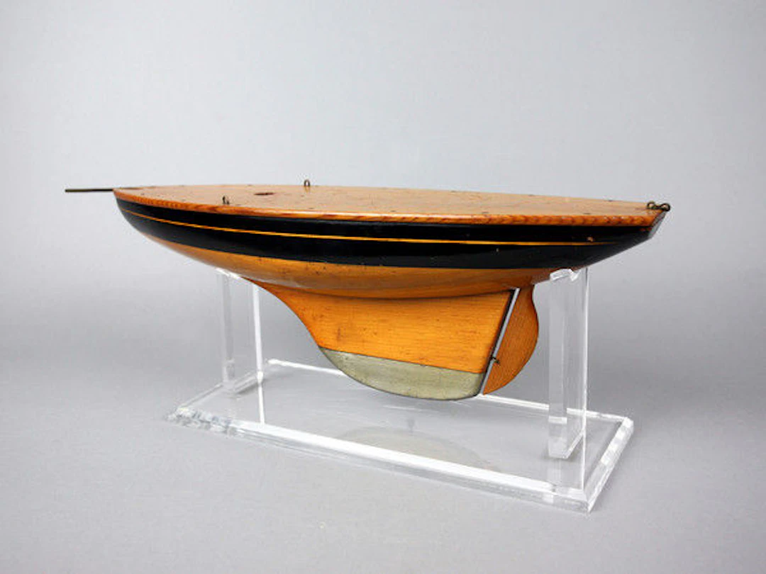 Small varnished and painted pond yacht hull