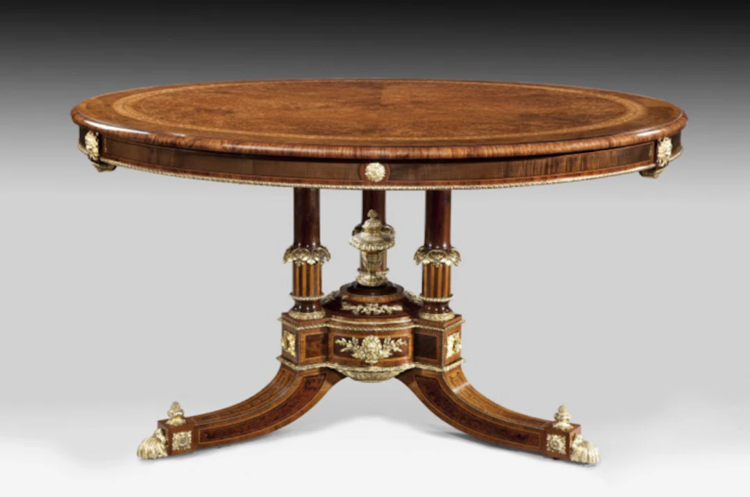 A centre table attributed to Holland and Sons related to a table in