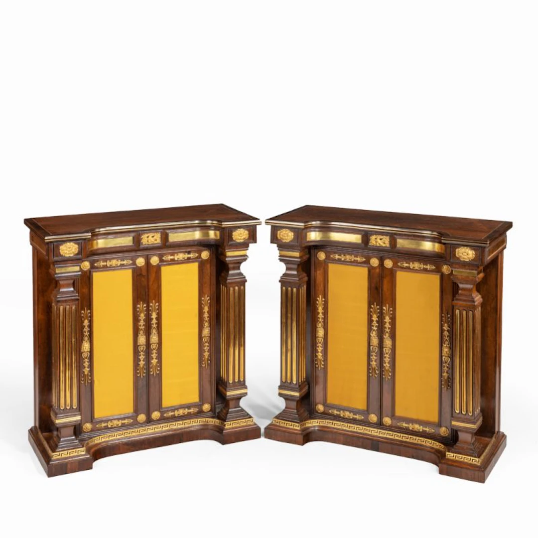 A pair of Regency brass-inlaid rosewood side cabinets