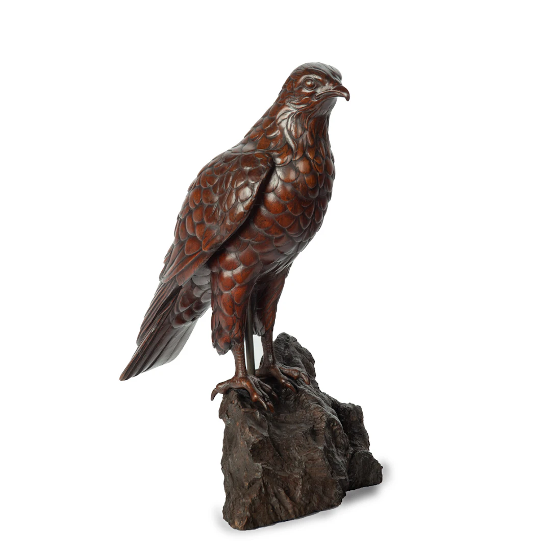 A Black Forest linden wood model of a hawk
