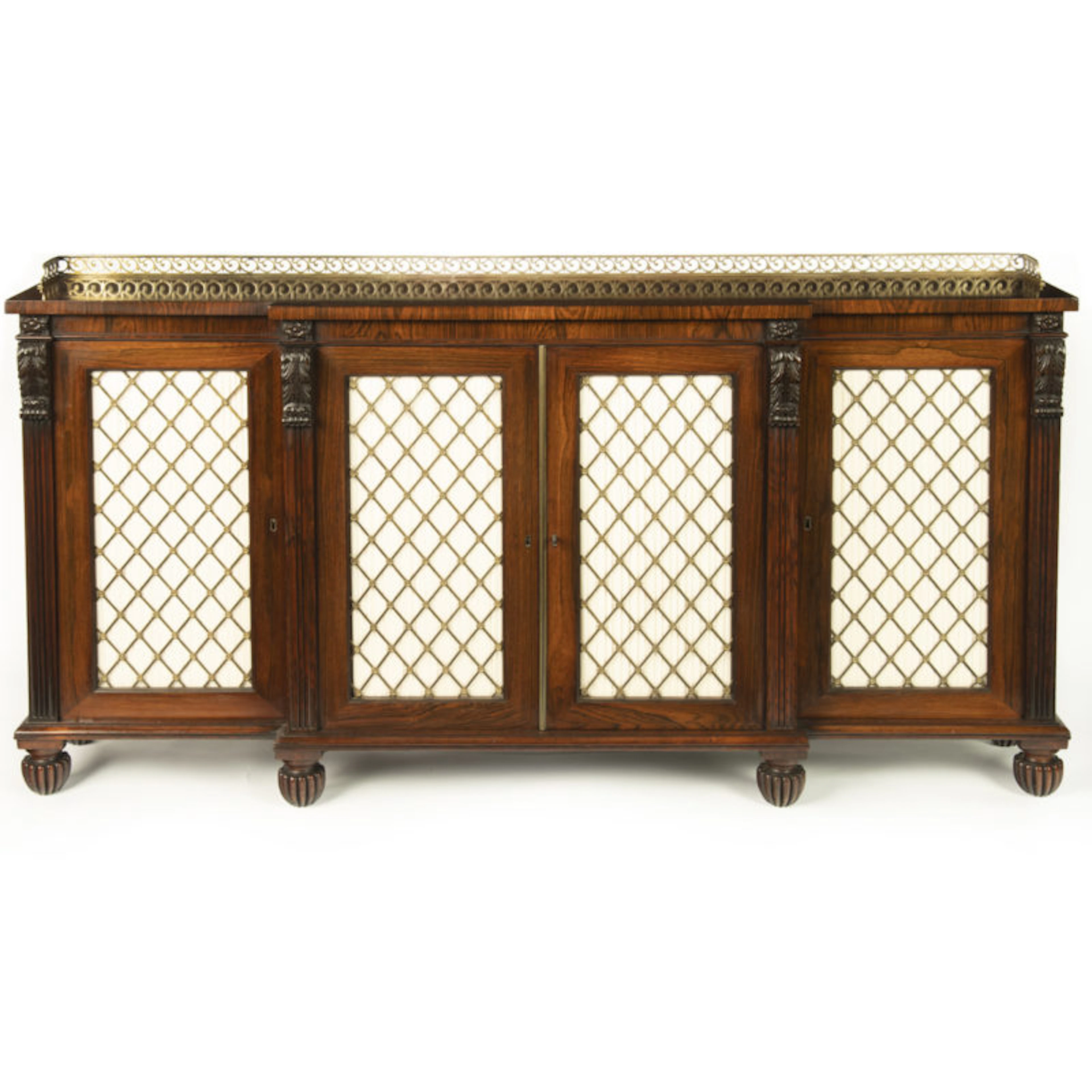 A late Regency rosewood breakfront four door side cabinet, attributed