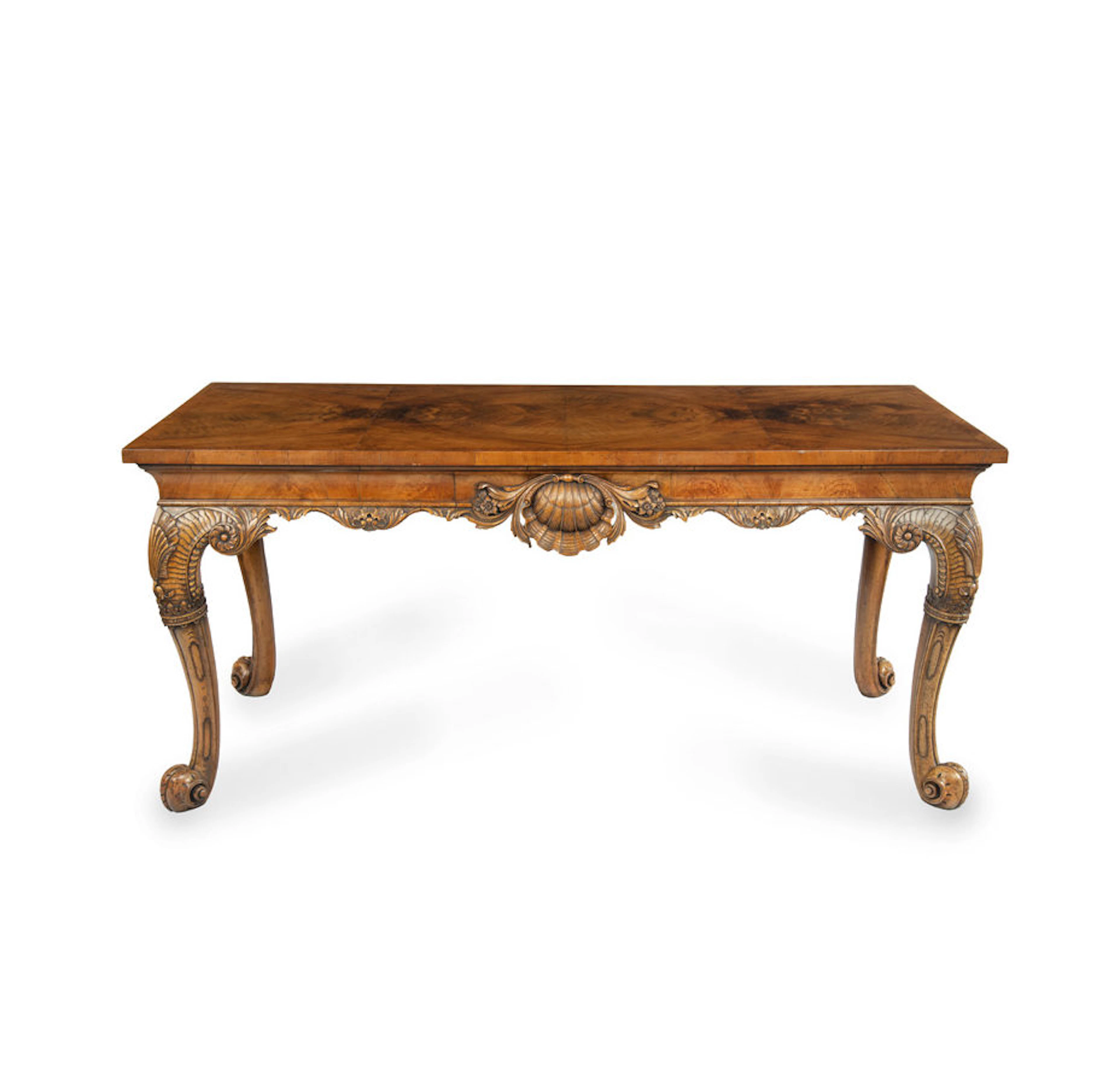 A finely carved walnut side table in the George II style by the Harry