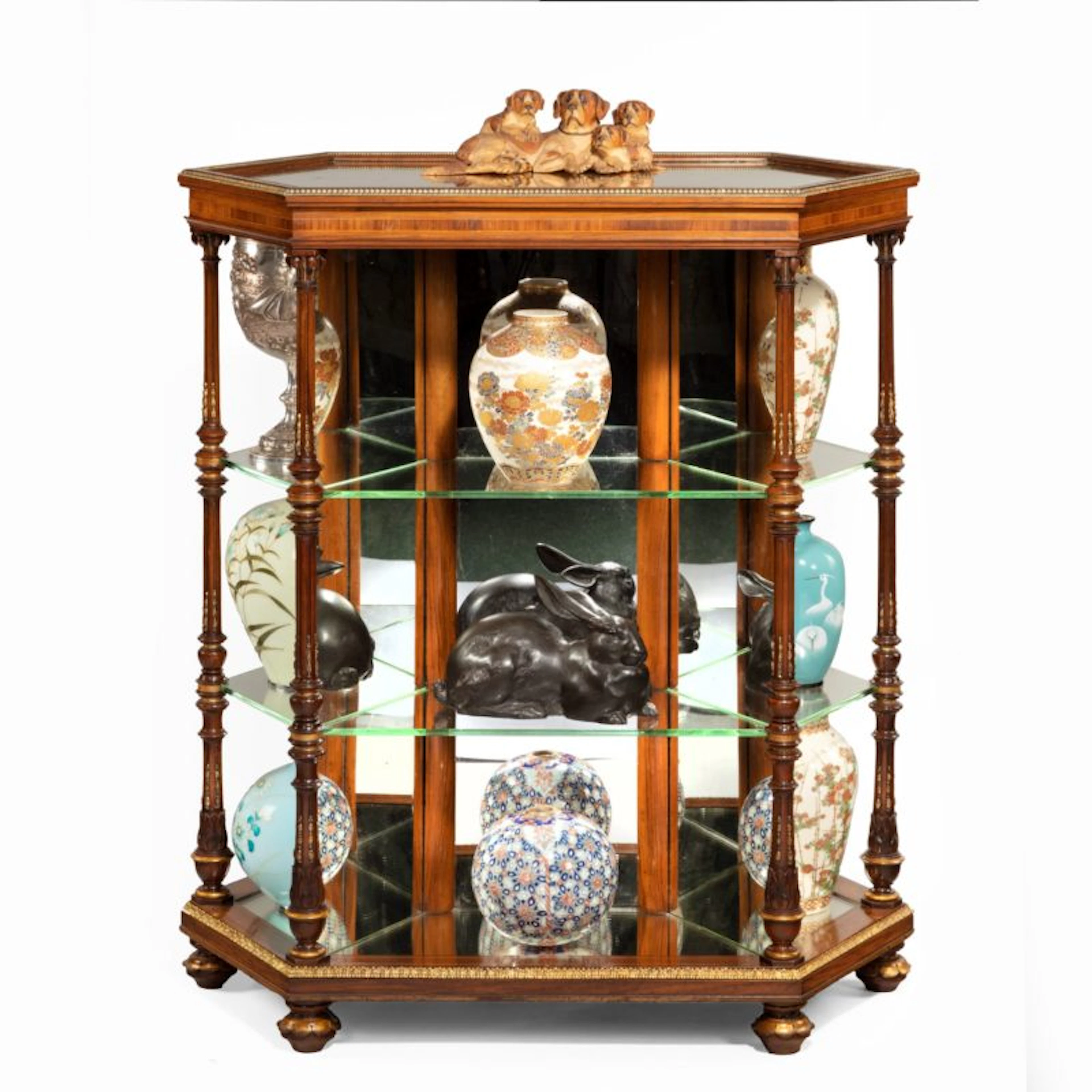 Hexagonal walnut display table attributed to Holland and Sons