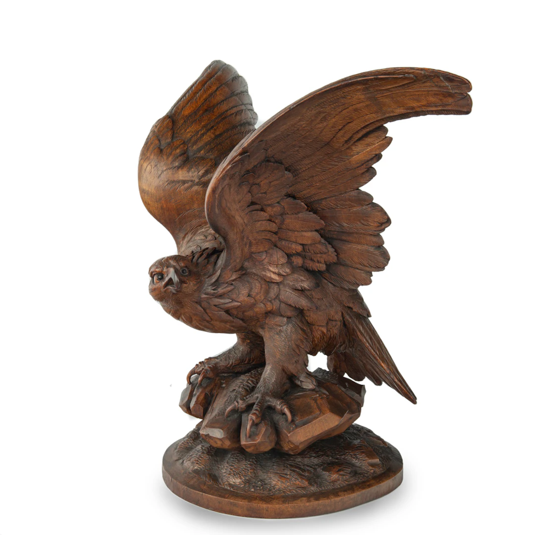 A large Black Forest walnut wooden carving of an eagle