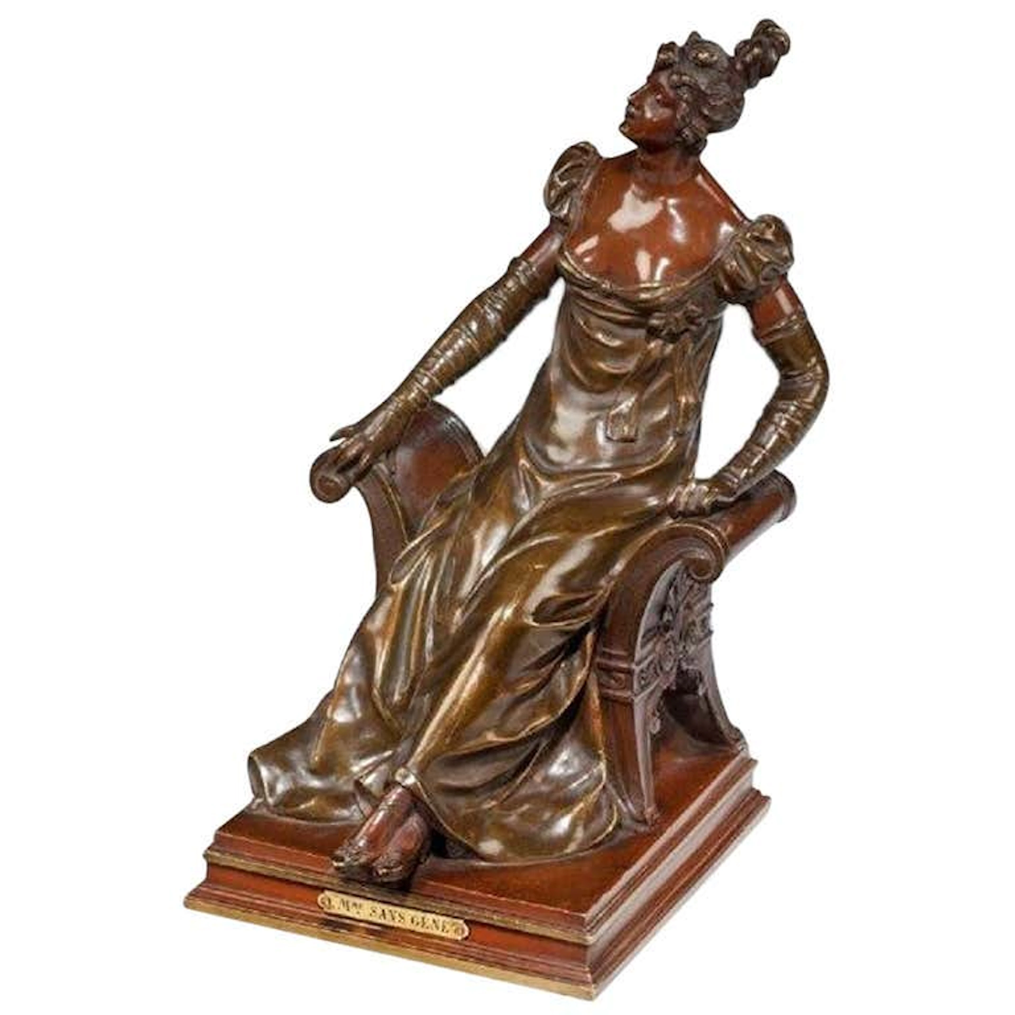 A bronze of an edwardian lady on a window seat