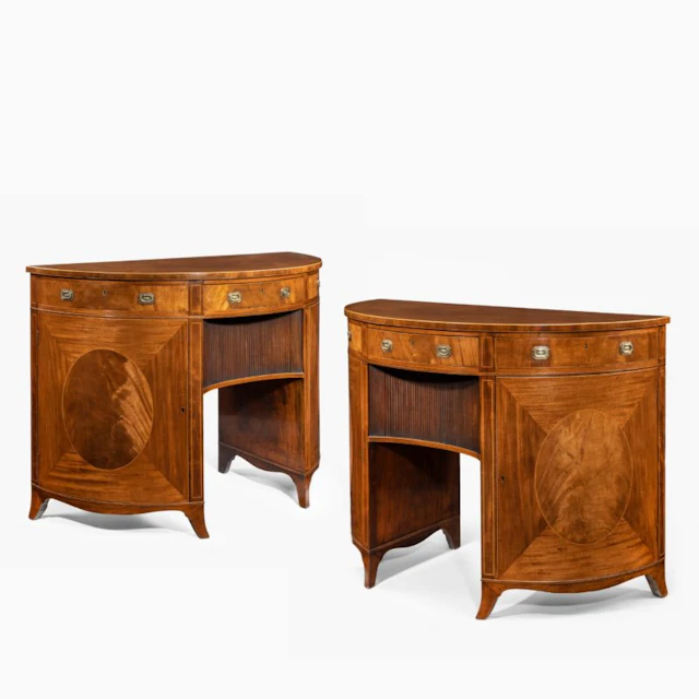 A fine pair of George III figured mahogany side cabinets, in the manner