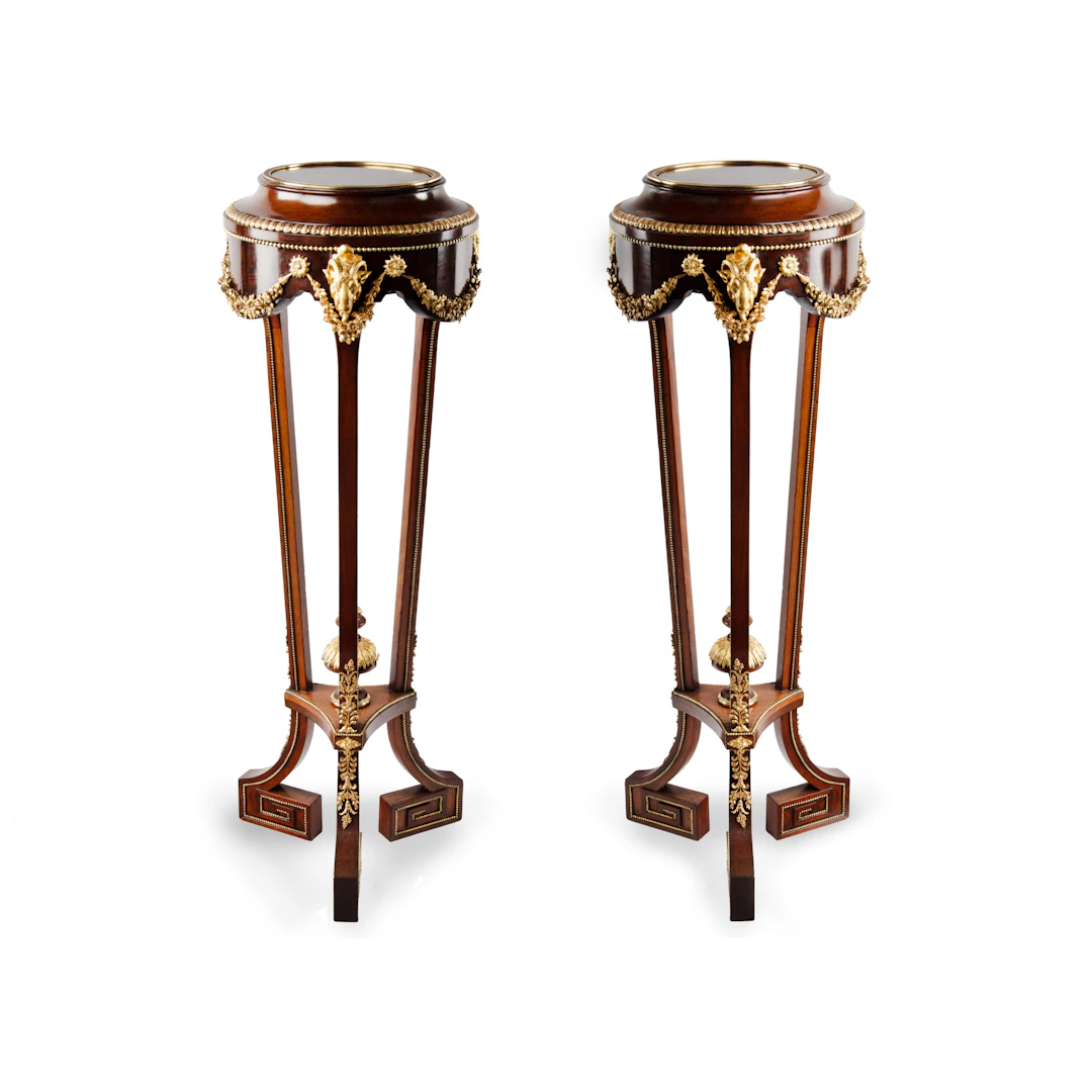 A pair of mahogany and gilt metal jardinières/torchères