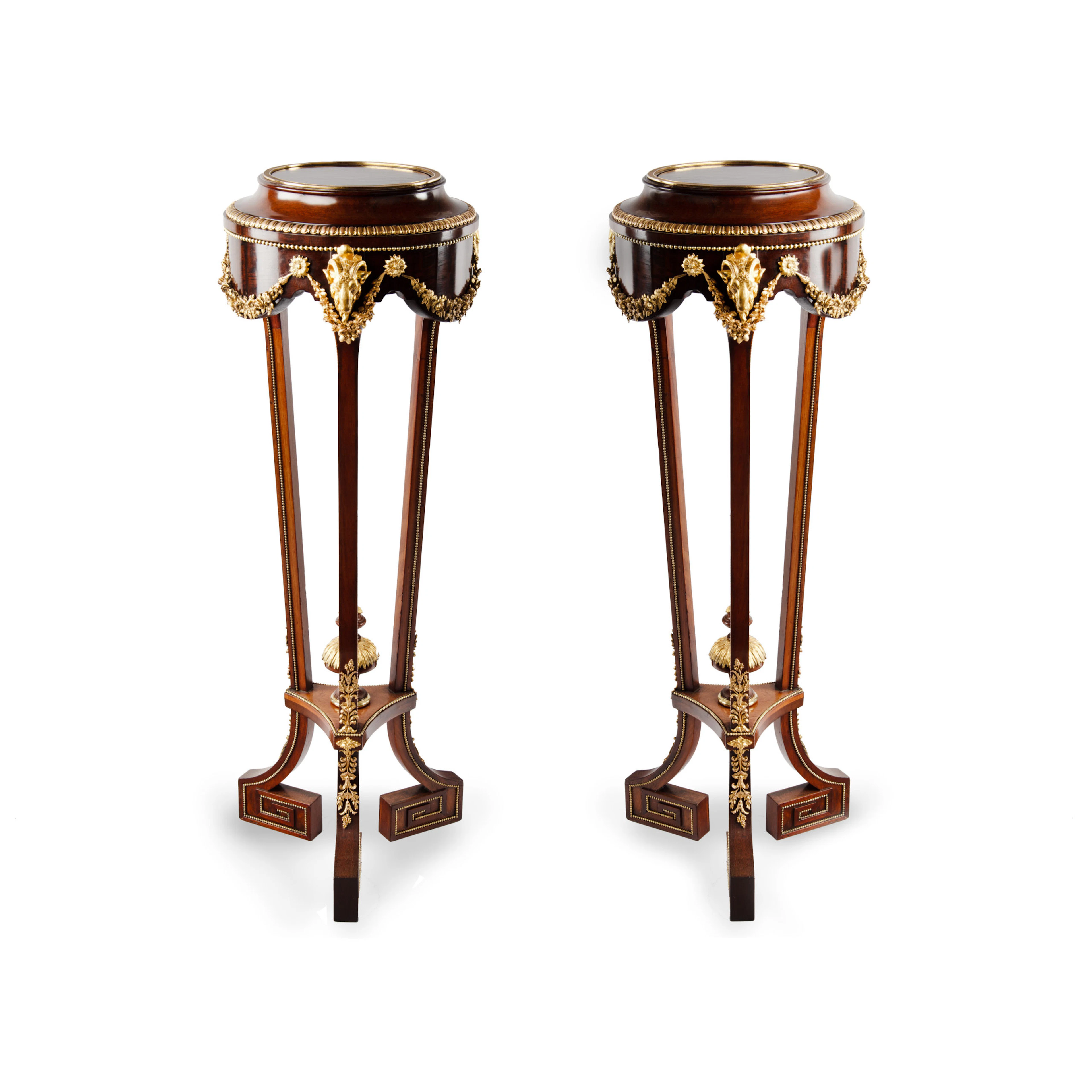 A pair of mahogany and gilt metal jardinières/torchères