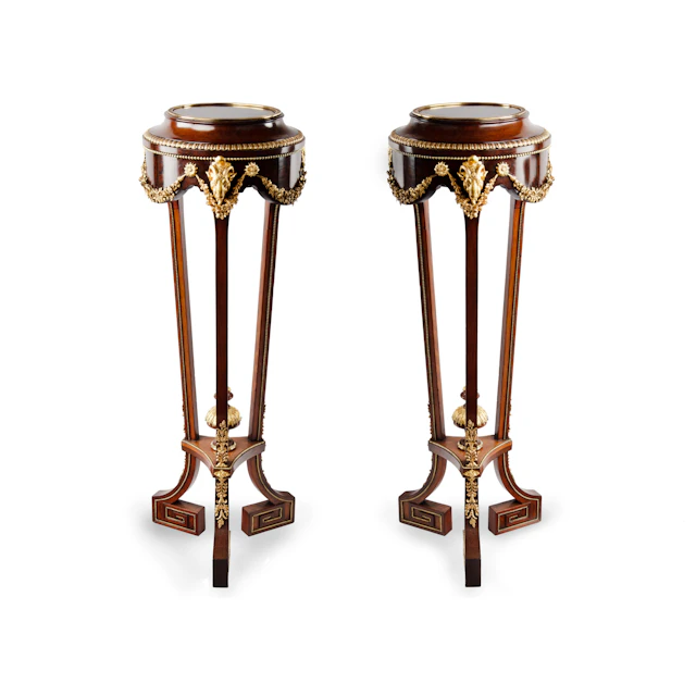 A pair of mahogany and gilt metal jardinières/torchères