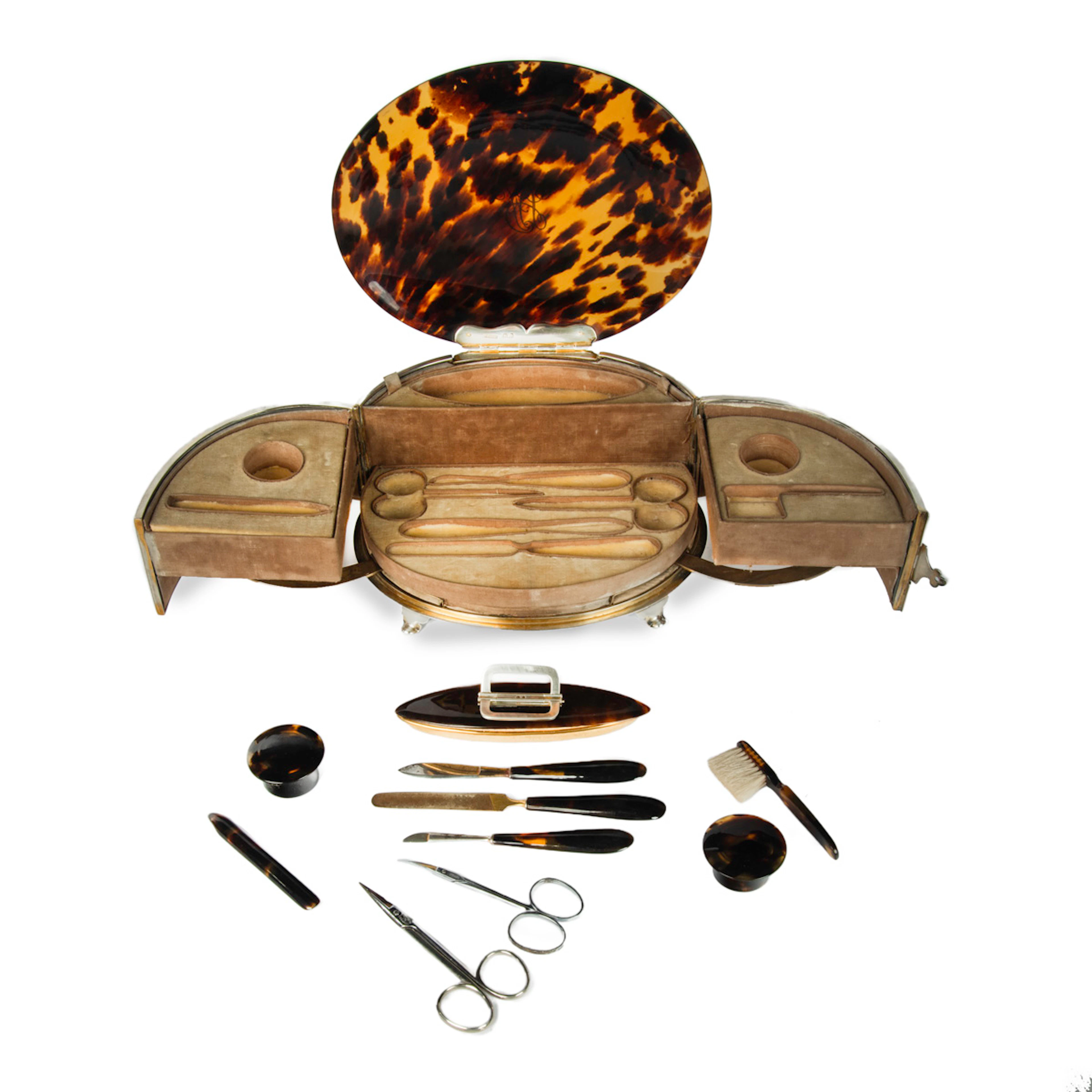 An Art Deco silver mounted tortoiseshell necessaire de toilette