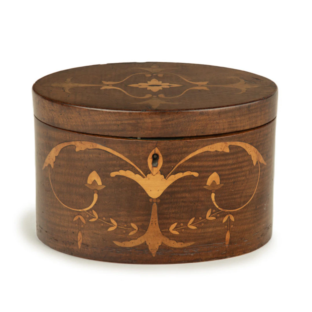 A harewood marquetry tea caddy with Royal Provenance