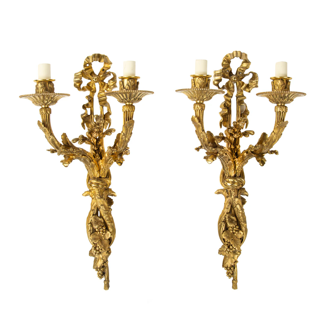 A pair of Napoleon III two-branch ormolu wall lights