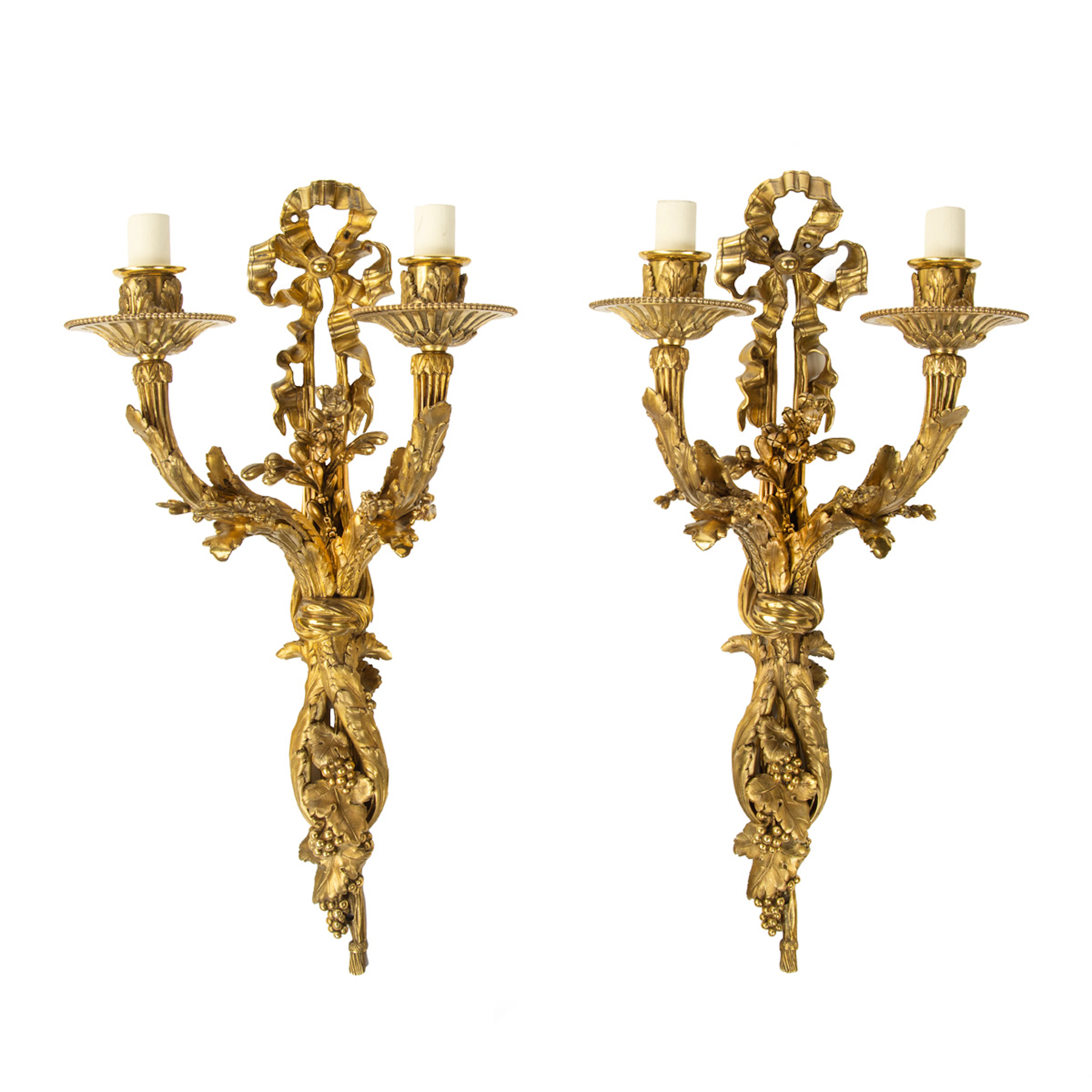 A pair of Napoleon III two-branch ormolu wall lights