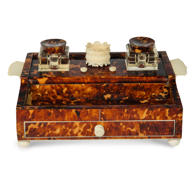 A Regency tortoiseshell and ivory desk set