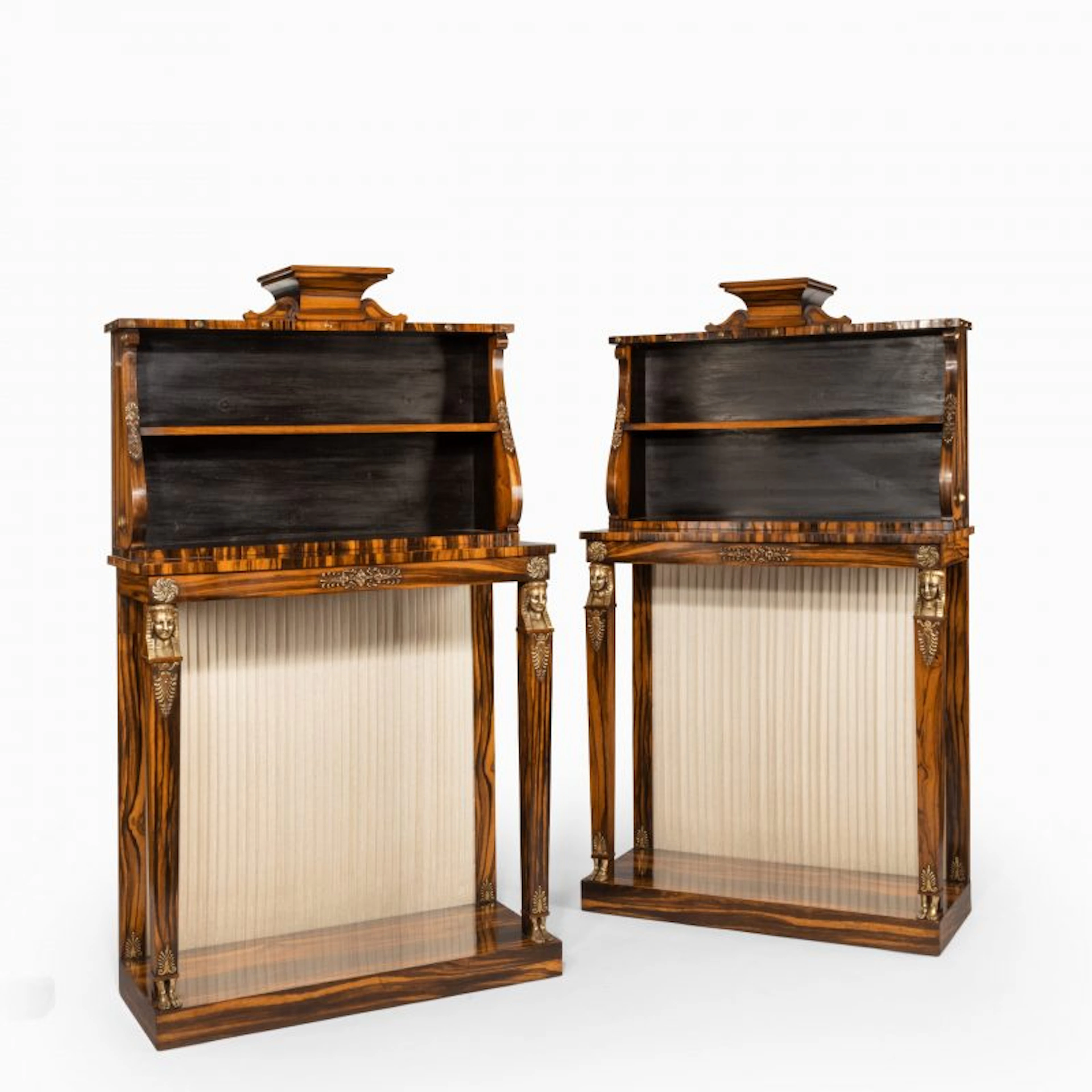 A pair of high Regency coromandel and ormolu bookcase console tables