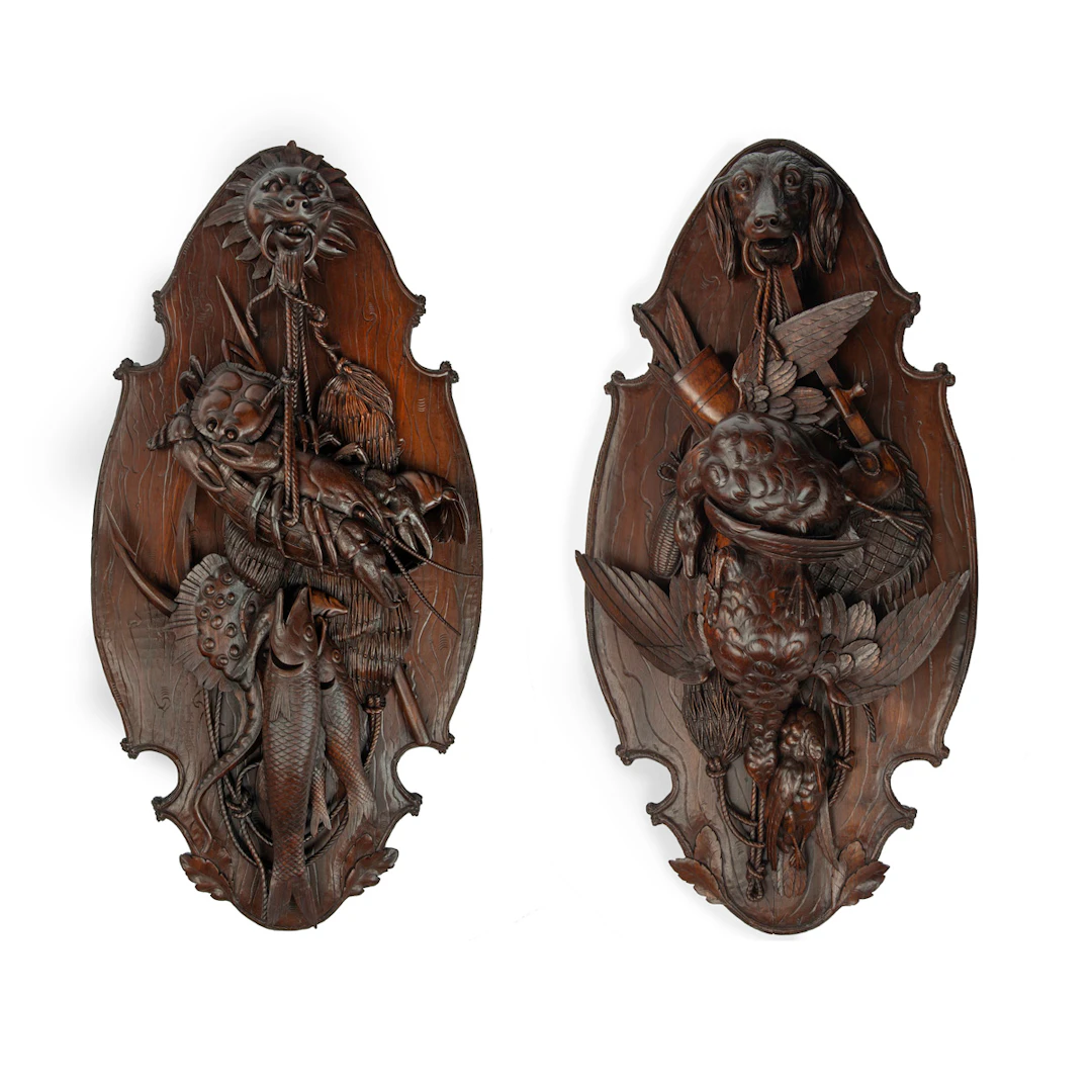 A very fine pair of ‘Black Forest’ walnut game plaques