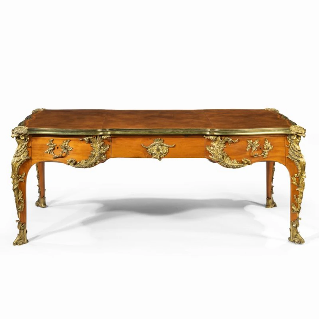 An outstanding Louis XV-style mahogany bureau plat after a model by