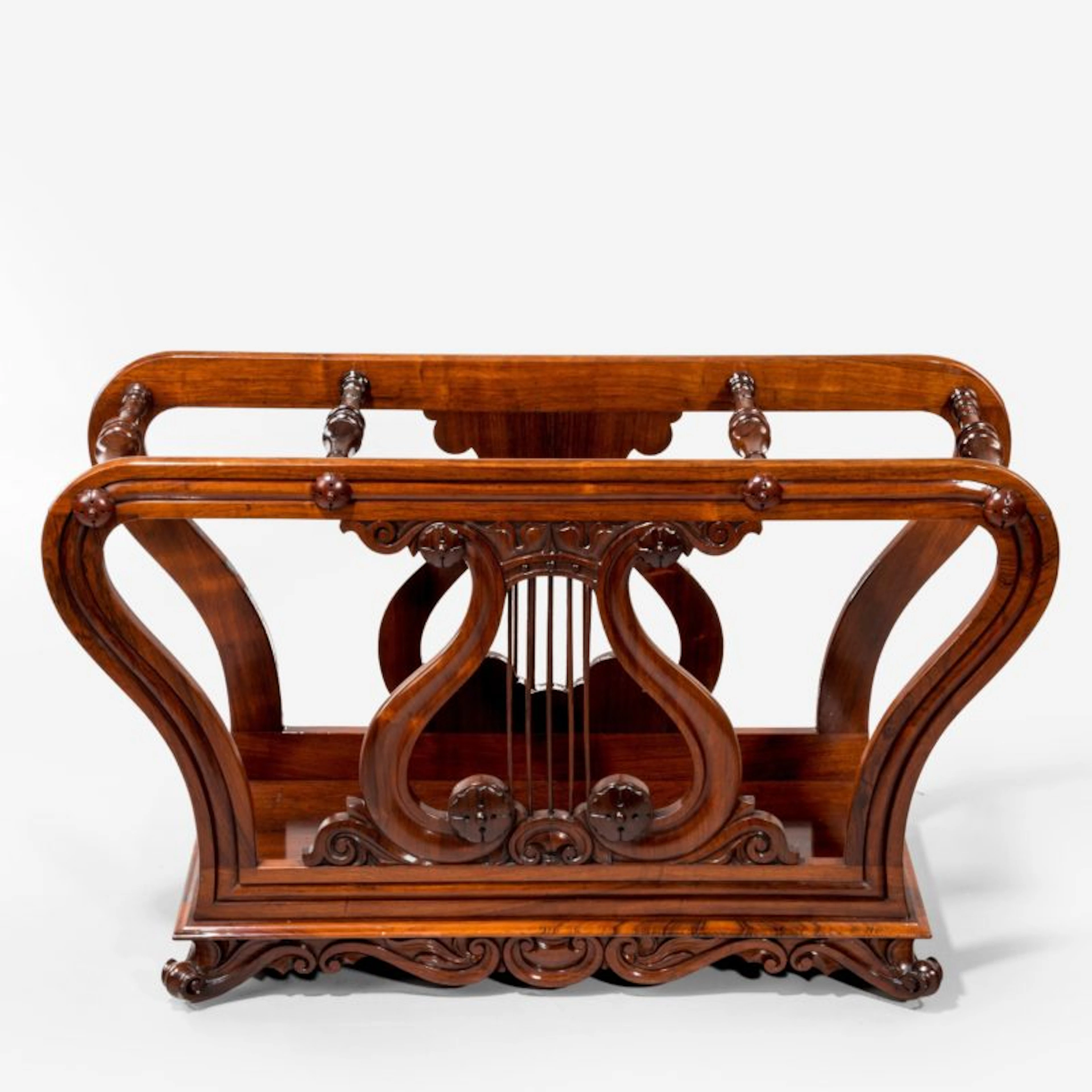 An unusual late Regency rosewood music roll holder