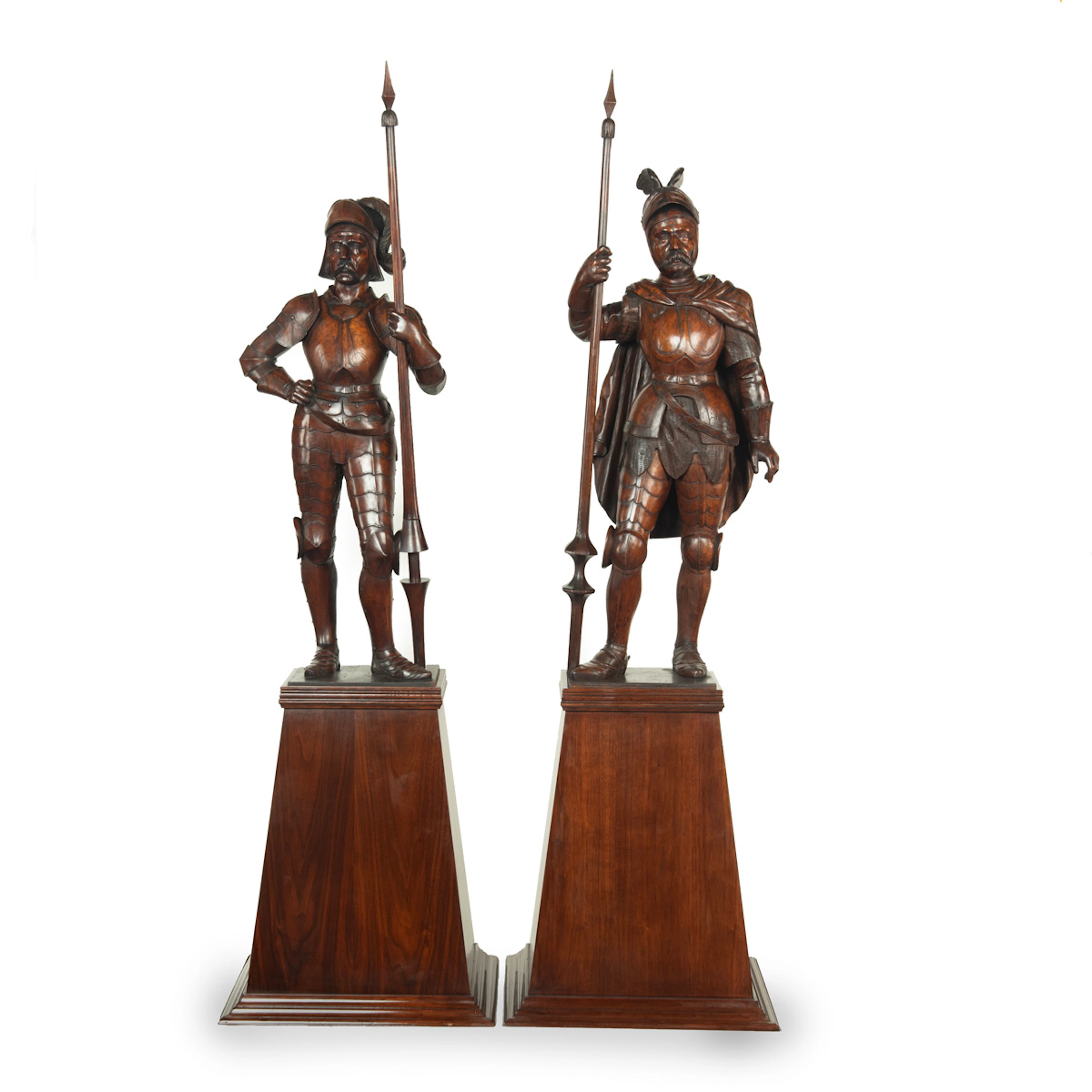 A pair of carved walnut mediaeval knights