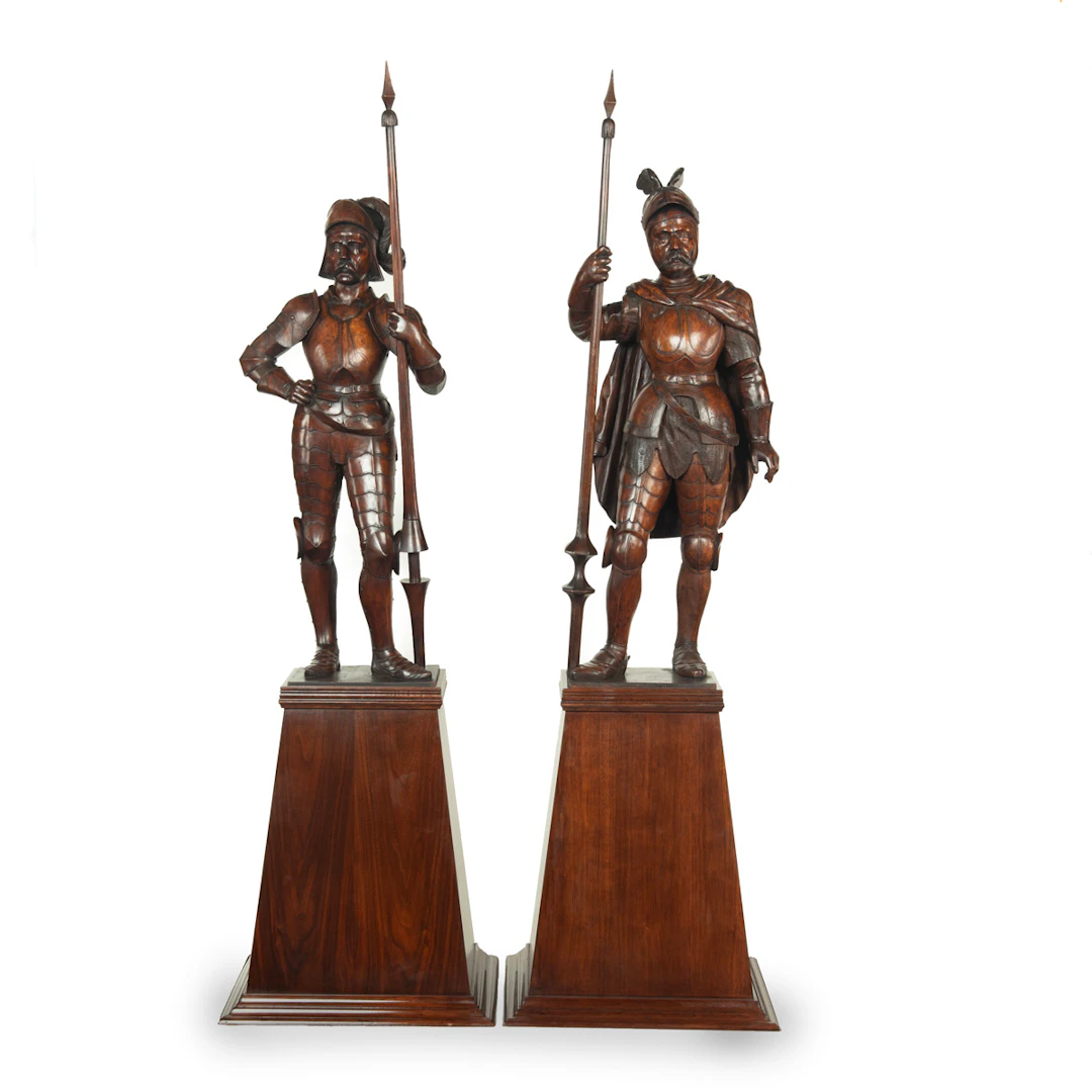 A pair of carved walnut mediaeval knights