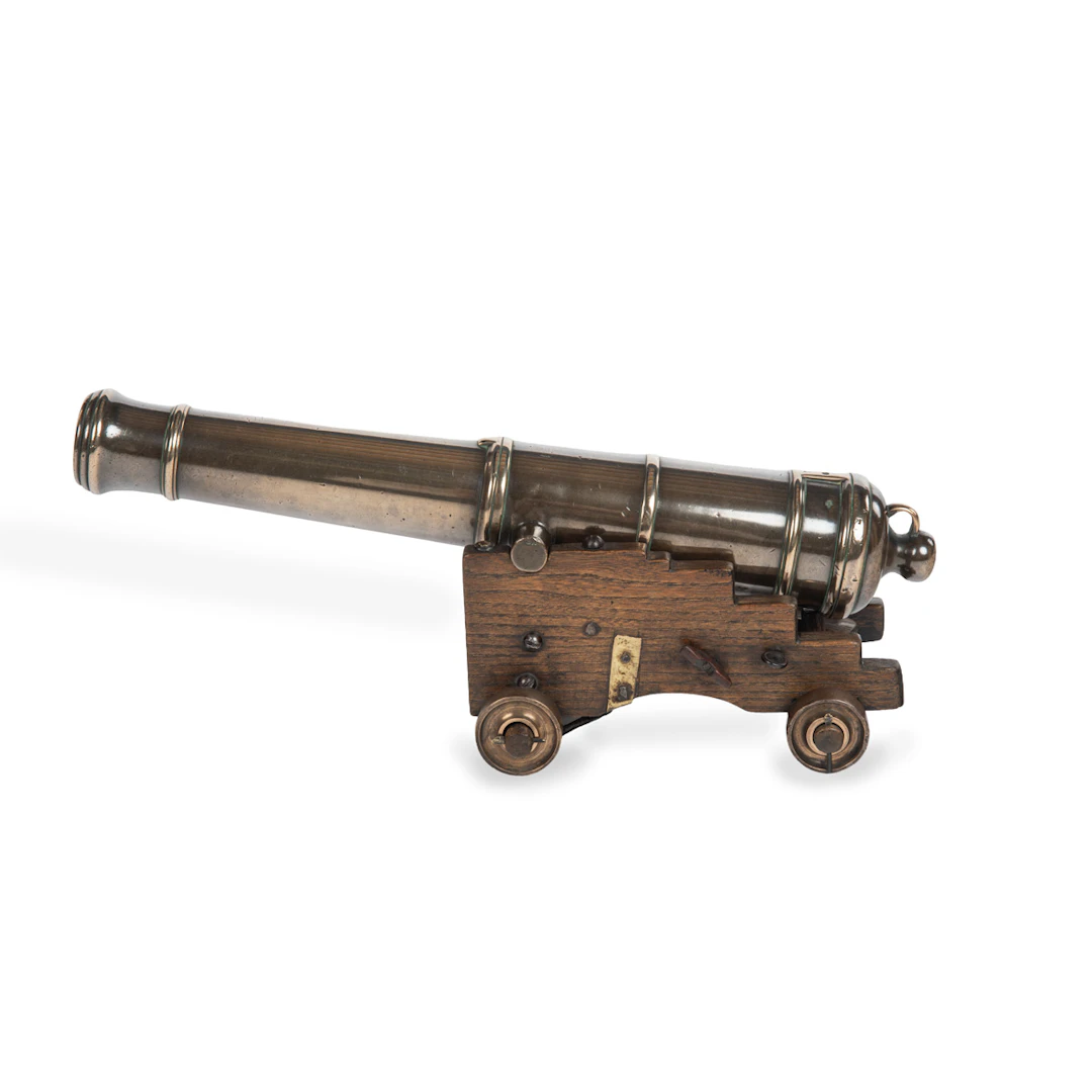 A fine bronze naval 5 stage signalling cannon on a naval dockyard