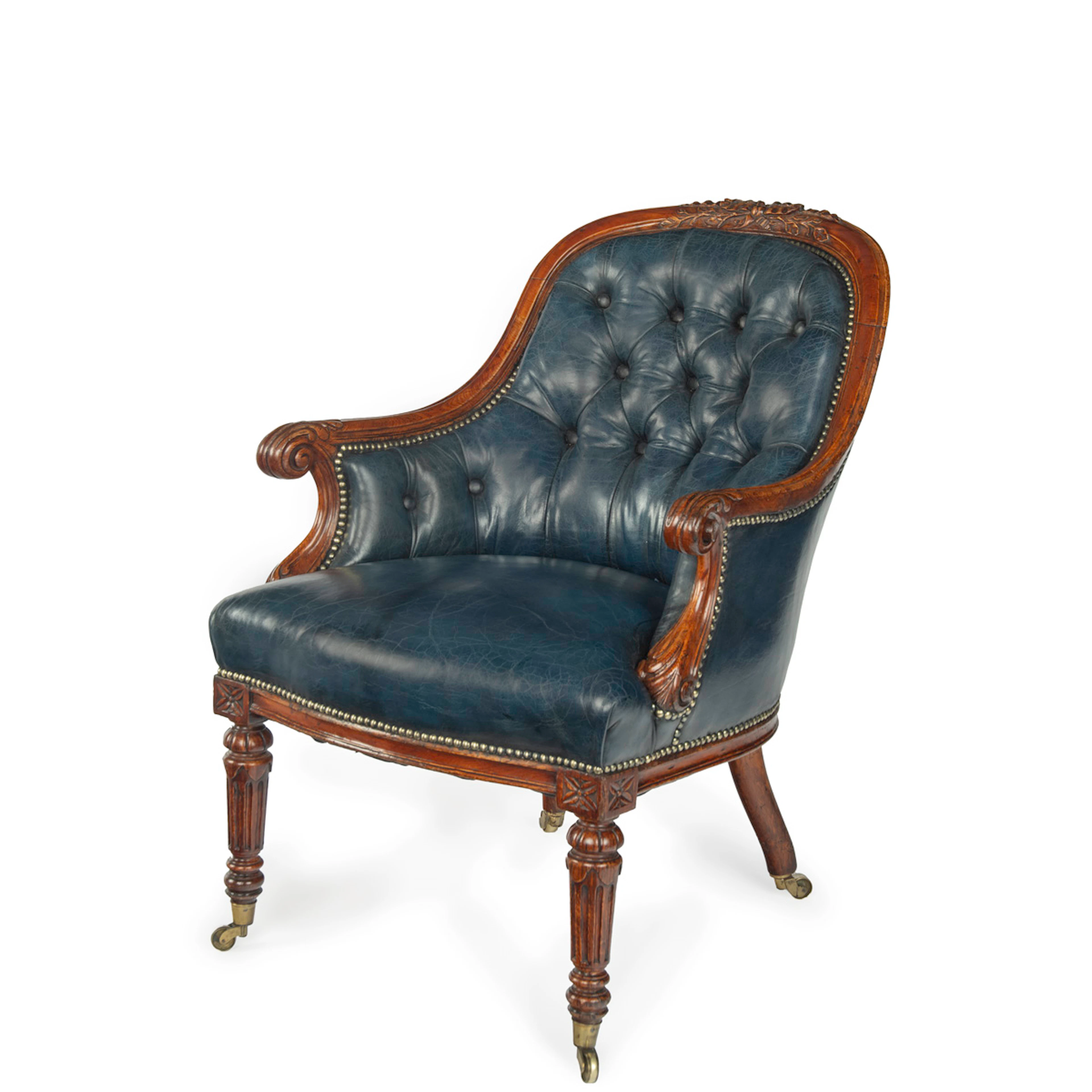 A Victorian blue leather oak library chair