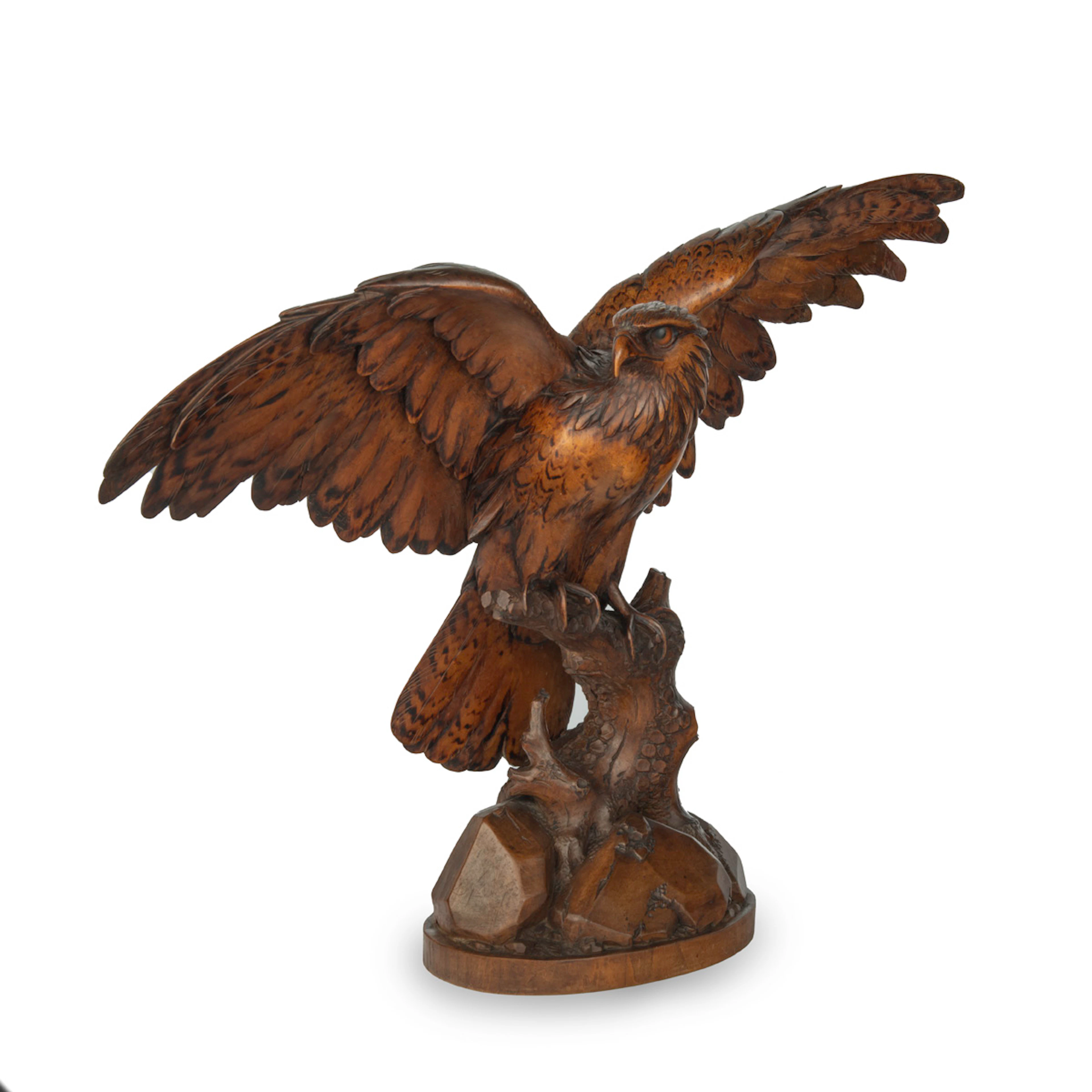 A large Black Forest walnut wooden carving of an eagle
